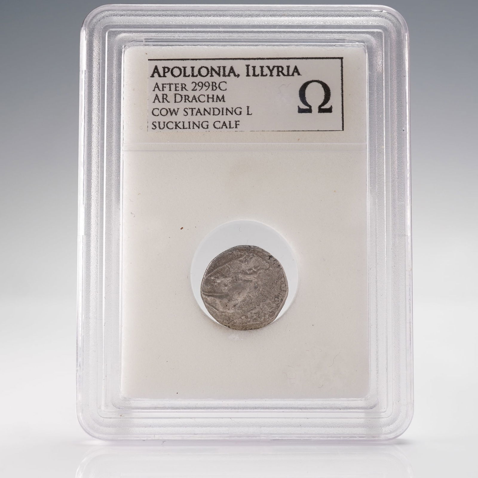 Ancient Greek Silver Drachm Apollonia Illyria After 299 BC: This ancient Greek silver drachm was struck at Apollonia in Illyria after 299 BC and features the well known civic type associated with the region. One side depicts a cow standing left while nursing a