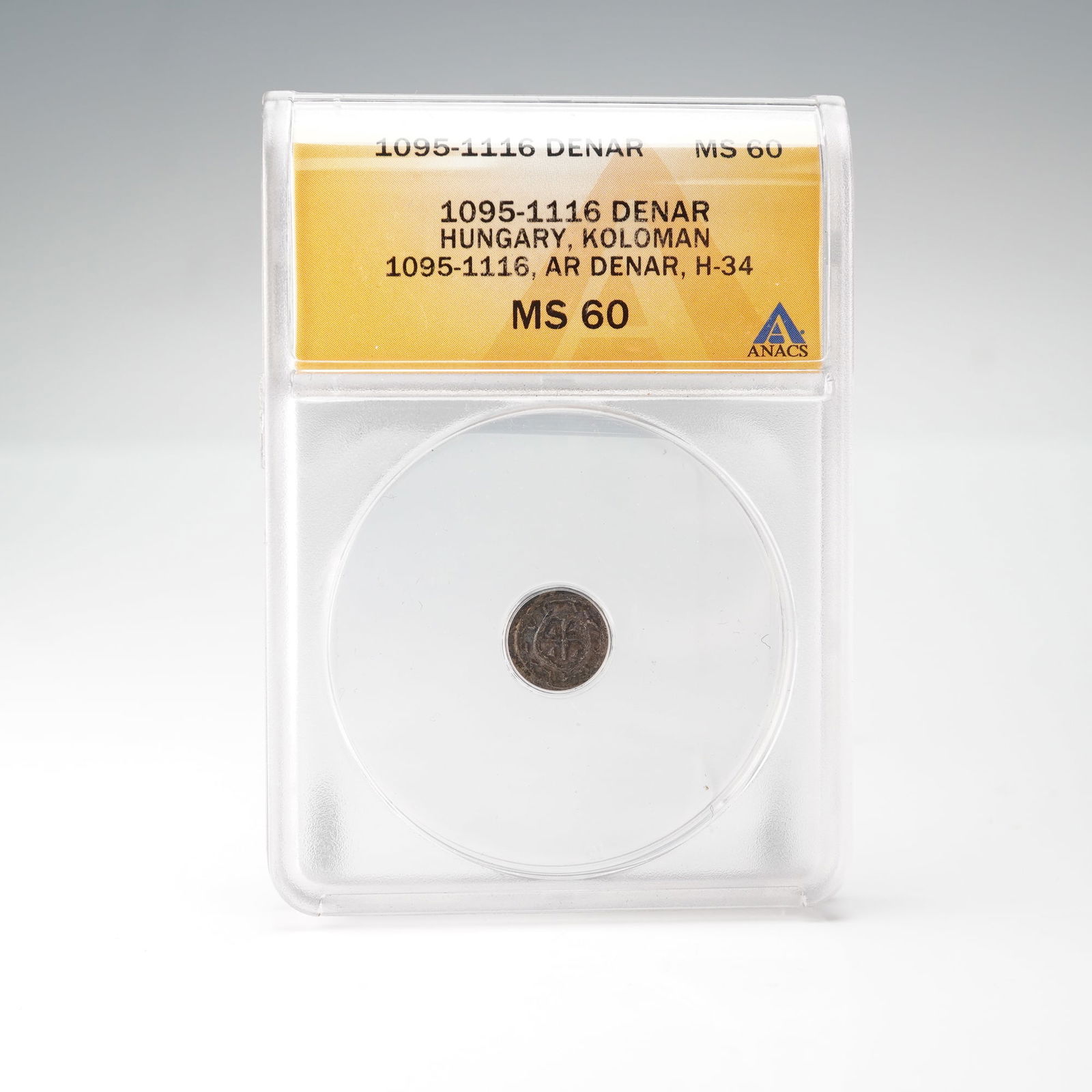 1095 to 1116 Hungarian Denar ANACS Graded MS-60 Coin: Certified by ANACS and graded MS 60. Struck in silver during the reign of King Coloman of Hungary, this medieval denar features a cross within a circle on the obverse and linear geometric patterns on