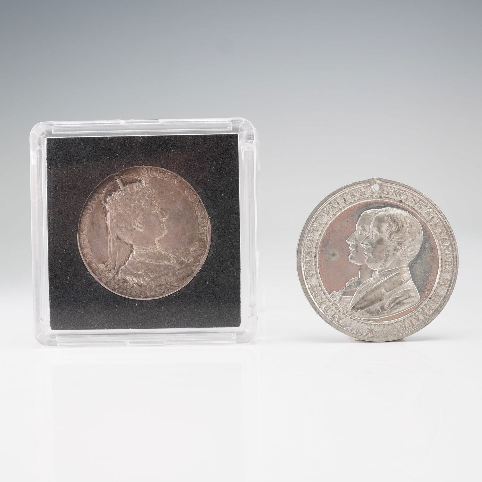 2pc 1863 & 1902 Edward VII & Alexandra Commemorative Medals: One medal displays the Prince and Princess of Wales with a dual-portrait obverse and a reverse inscribed with the 1863 marriage date beneath the heraldic Prince of Wales feathers. The other medal pres
