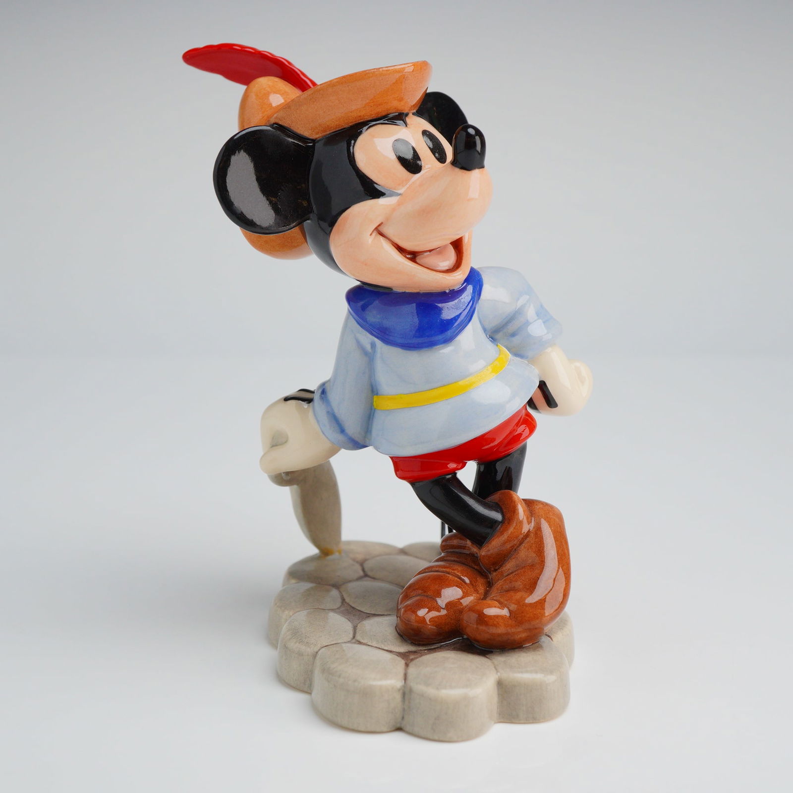 Royal Doulton Disney Showcase Mickey Brave Little Tailor Figurine: A hand-decorated fine stoneware figurine from the Walt Disney Showcase Collection by Royal Doulton, depicting the character Mickey Mouse in the role of "The Brave Little Tailor" from the 1938 short