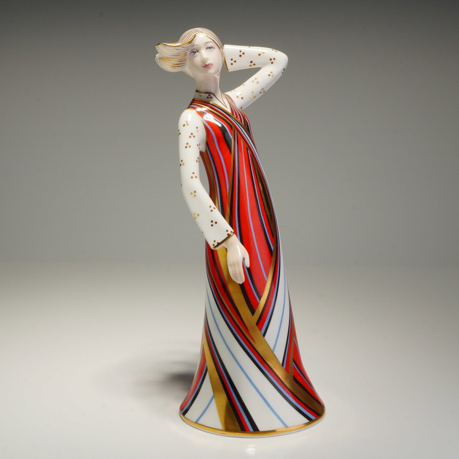 Royal Crown Derby The Classic Collection Penelope Figurine: This Royal Crown Derby figurine from The Classic Collection, titled Penelope, is constructed of English bone china. Dated 1986, the piece is modeled in a stylized Art Deco manner, depicting a female f