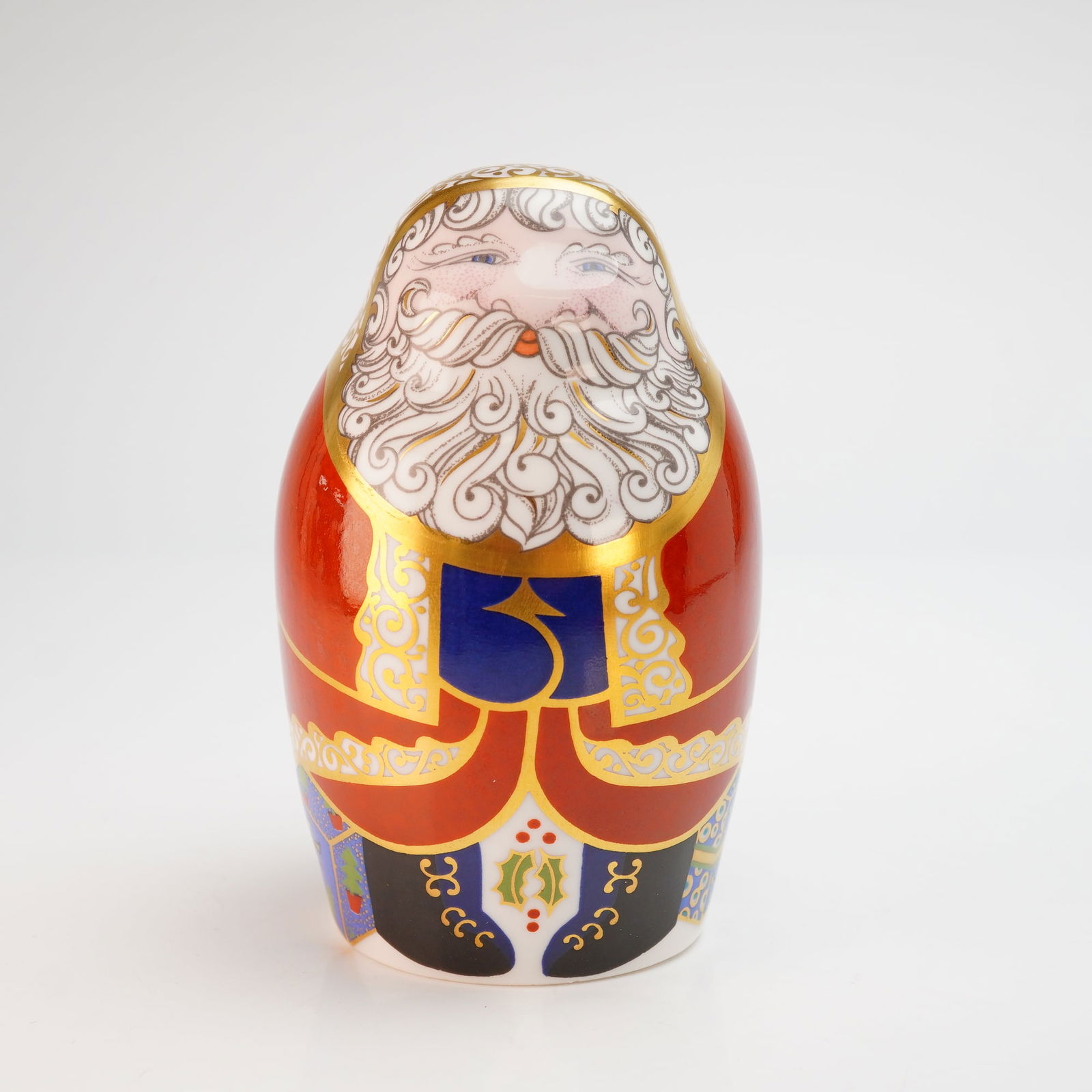 Royal Crown Derby Santa Claus Paperweight with Box: A Royal Crown Derby fine bone china paperweight depicting Santa Claus in an ovoid form, styled after a Russian nesting doll. The figurine is decorated in a traditional Imari palette of iron red, cobal