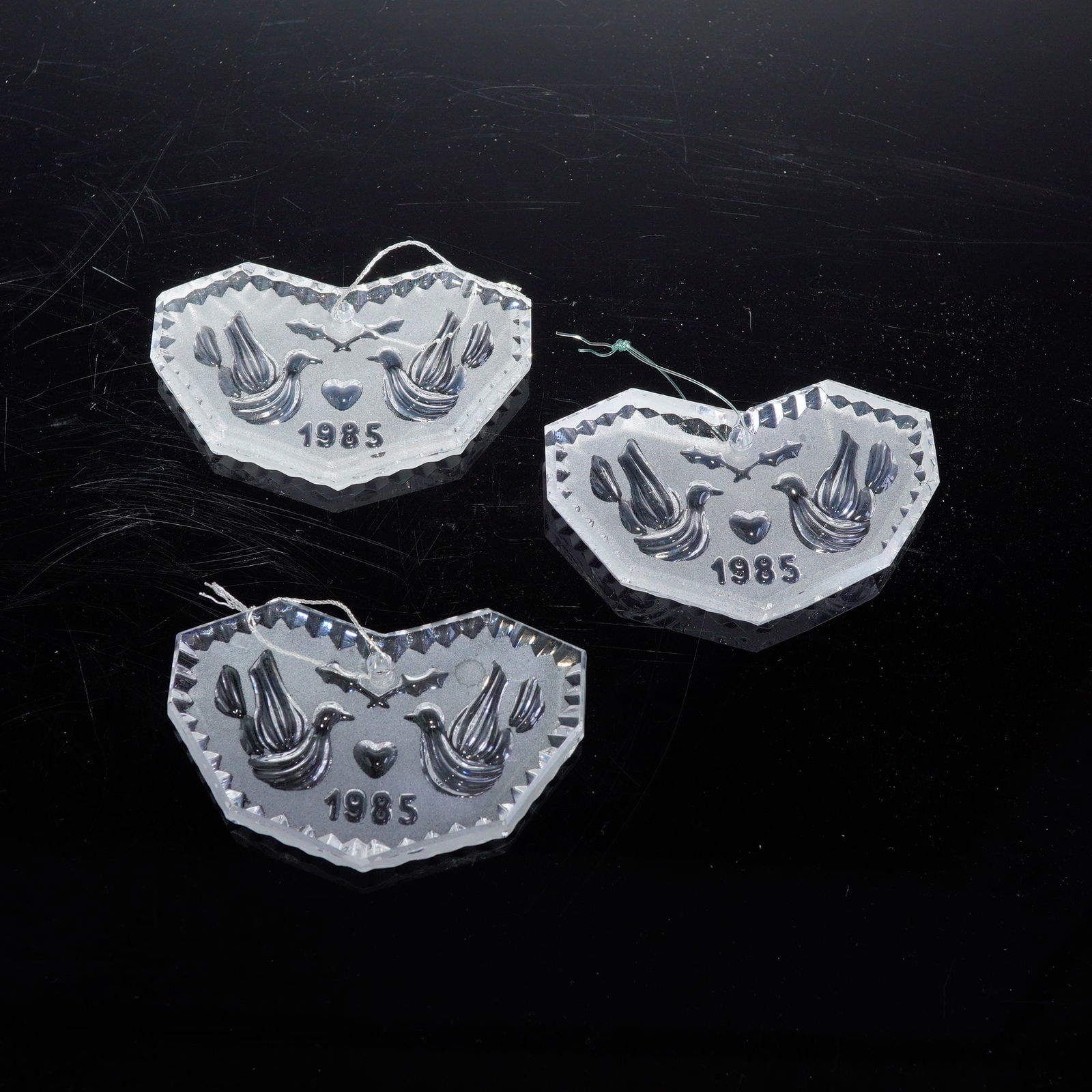 3pc Waterford Crystal Annual Holiday Ornaments, 1985: This lot features a 3-piece set of Waterford Crystal 1985 Annual Holiday Ornaments. Each piece showcases Waterford's signature brilliance and finely cut detail, making them ideal additions for