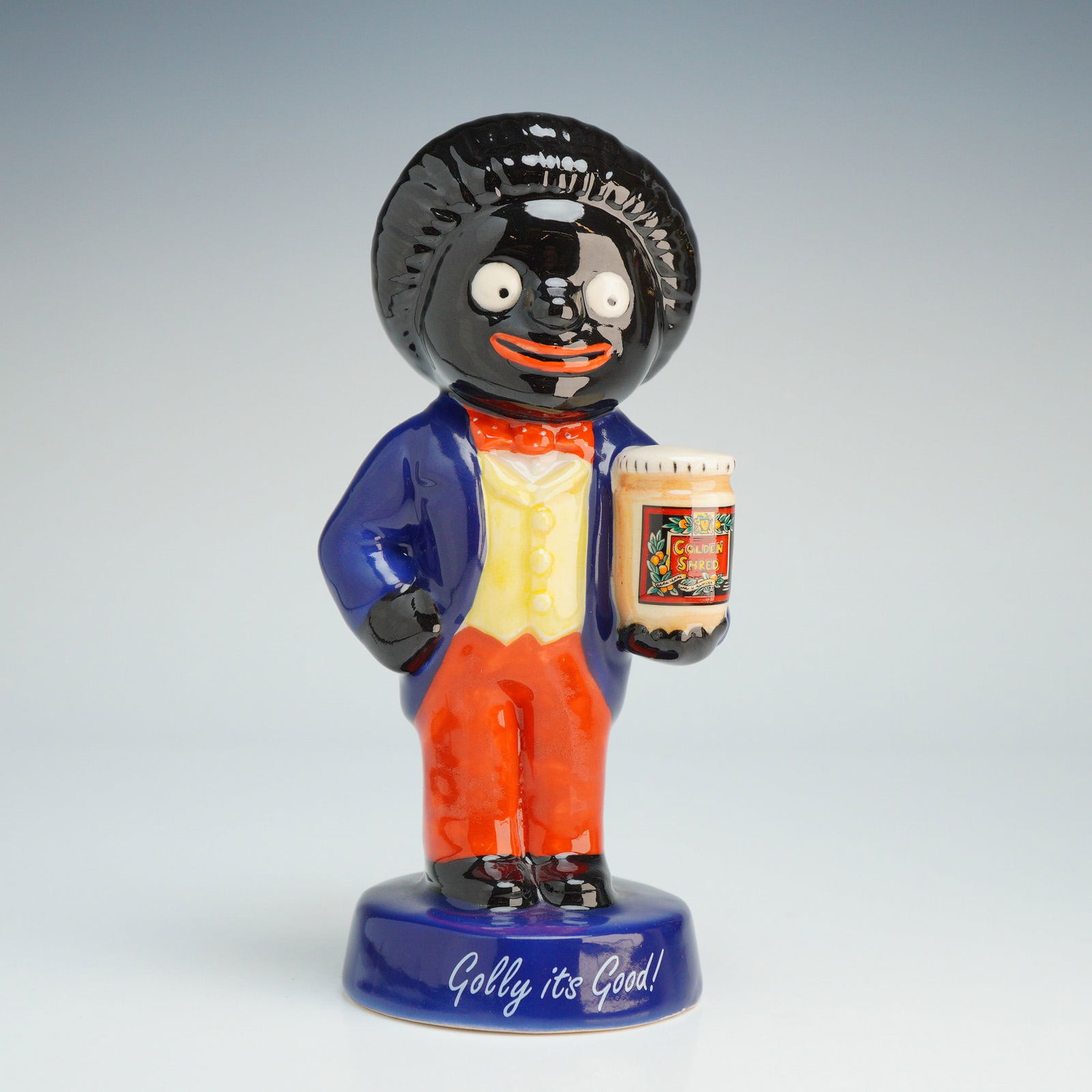 Royal Doulton 20th Century Advertising Figurine, Golly AC1: Part of the 20th Century Advertising Classics series and depicting the Golly mascot for James Robertson & Sons. This hand-made and hand-decorated figure is shown wearing a blue tailcoat, yellow waistc