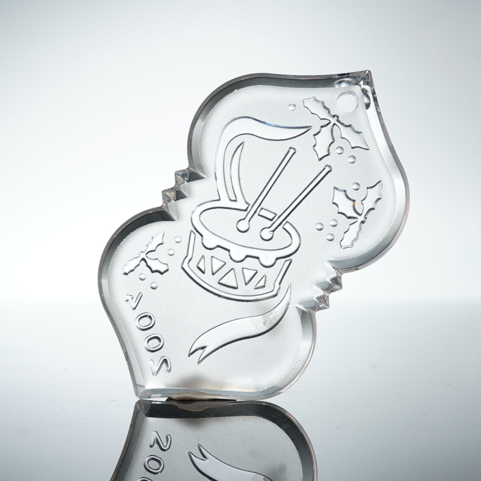 Waterford Crystal Ornament, 2004 Little Drummer Boy: The lead crystal ornament is the 2004 9th Edition from the Songs of Christmas collection, titled Little Drummer Boy. The ornament features an etched design of a drum, drumsticks, and holly leaves,