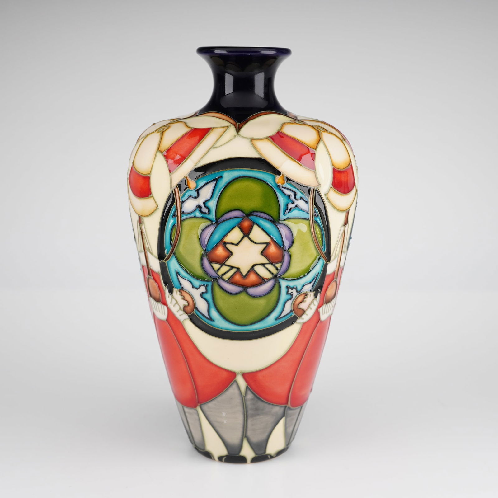 Moorcroft Bellringers Limited Edition Vase: A Moorcroft pottery vase in the Bellringers pattern, produced as a limited edition. The ceramic vessel is of high-shouldered, tapering form with a flared, deep-blue neck. The exterior features