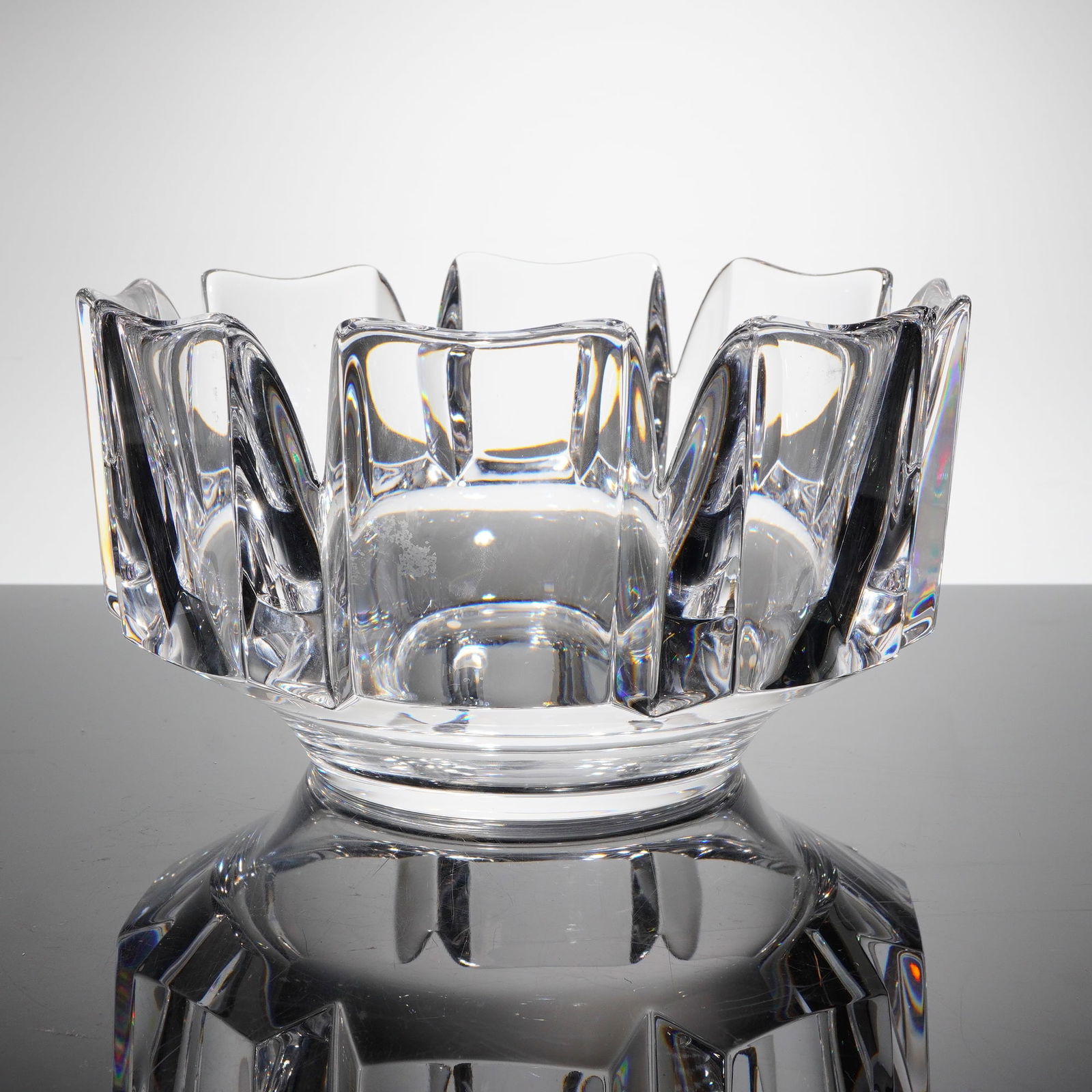 Orrefors Corona Crystal Bowl by Lars Hellsten: A single heavy cut crystal centerpiece bowl designed by Lars Hellsten for Orrefors, Sweden, in the "Corona" patern. The bowl is crafted from clear, polished lead glass or crystal and features a highly