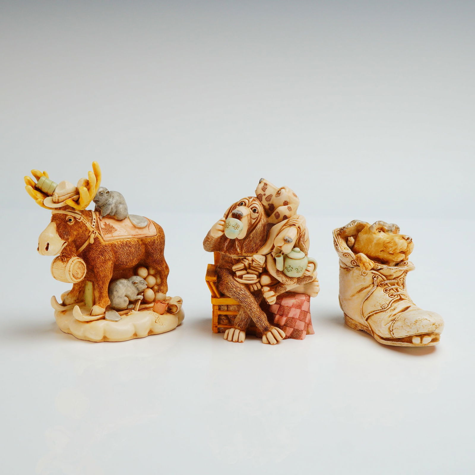3pc Harmony Kingdom Box Figurines, Beer Nuts, Solemate, & E.C Tea Party: Beer Nuts depicts a moose standing on a snowy base with a log harness and a small bear figure riding on its back, additional woodland animals and beer barrel elements incorporated into the base; model