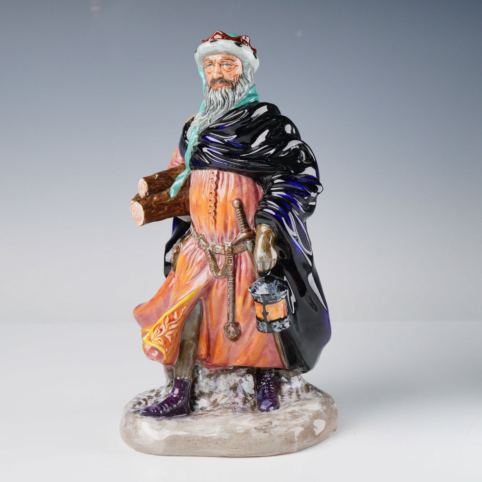 Royal Doulton Figurine, Good King Wenceslas HN2118: Royal Doulton figurine titled -Good King Wenceslas, HN2118, designed by Peggy Davies as part of the Literary Characters series. The figure depicts the noble king in flowing robes, captured mid-stride