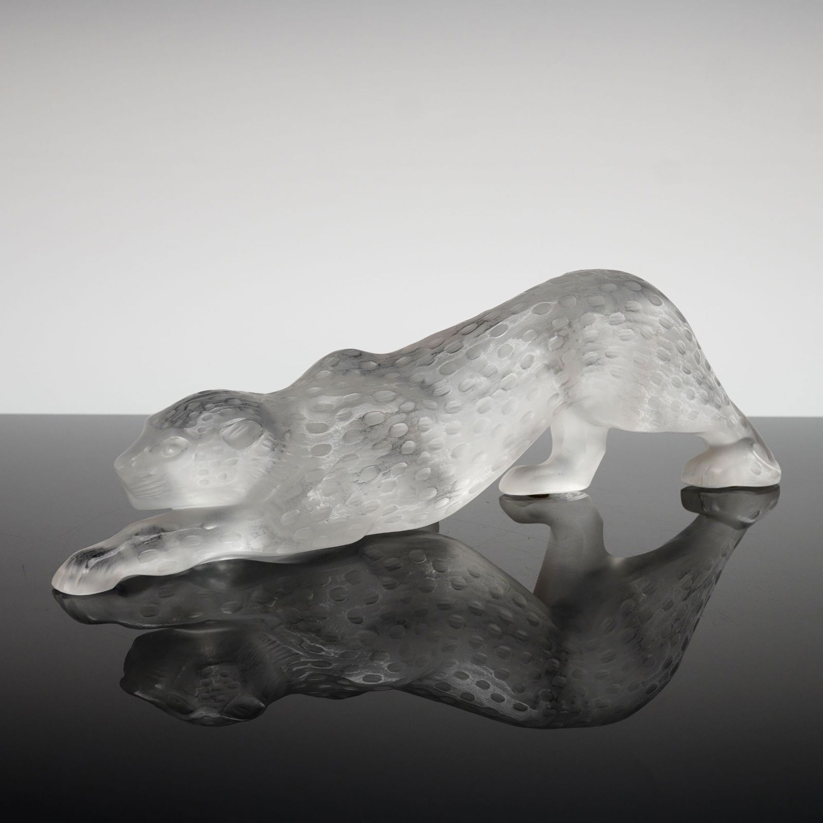 Lalique France Large Frosted Crystal Sculpture, Zeila Panther: Lalique France frosted and polished clear crystal figurine titled Zeila. This piece depicts a stalking panther in a sleek, modernist style. Nimble and sensual, she approaches stealthily, preparing for