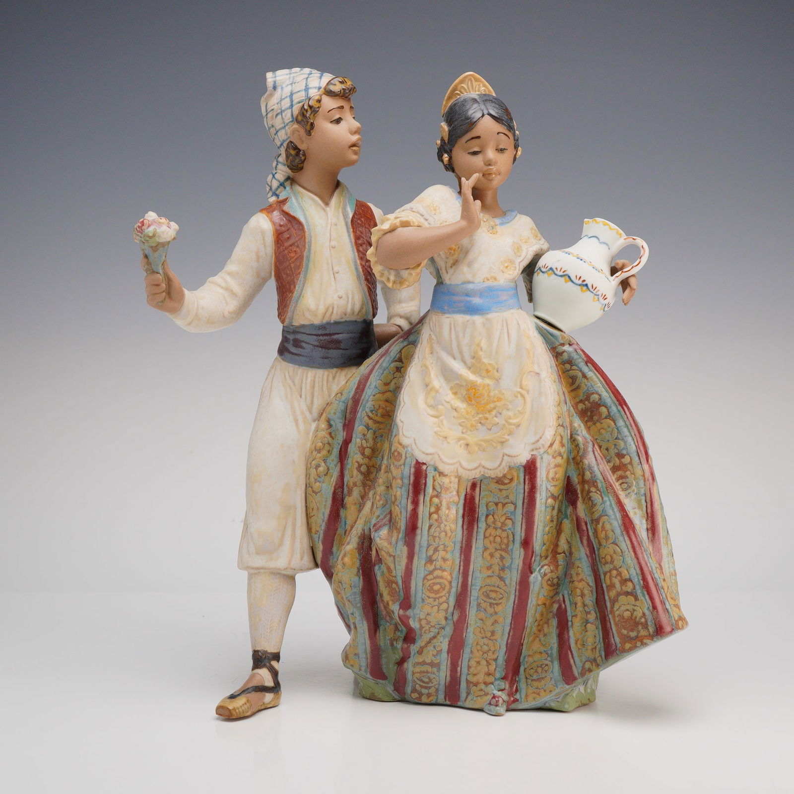 Lladro Valencian Courtship (Cortejo Valenciano) Gres Figurine, Model 2239: This Lladro gres porcelain figurine, titled Valencian Courtship (Cortejo Valenciano) and assigned model number 2239, was designed by sculptor Joan Coderch. The piece depicts a young couple in traditio