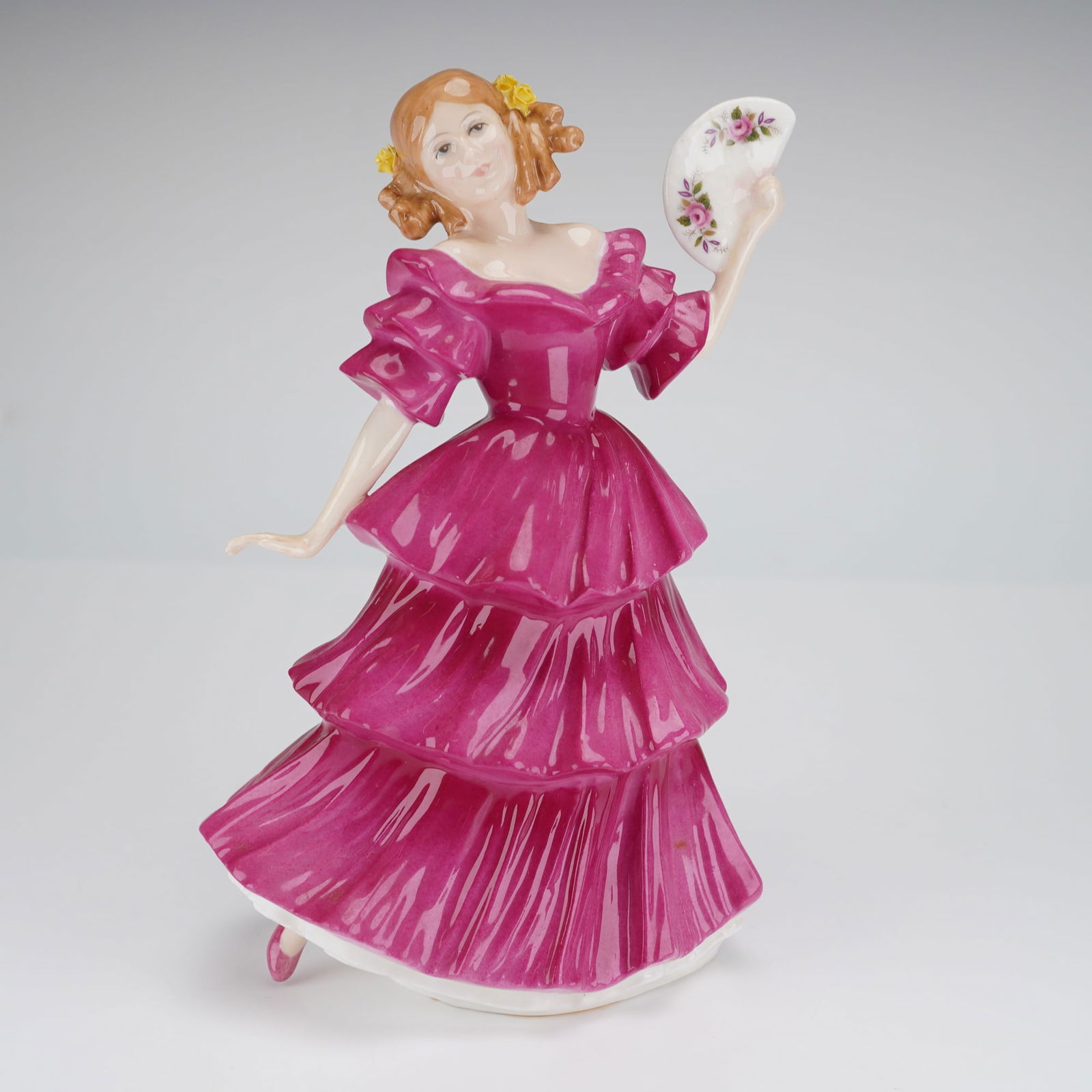 Royal Doulton Jennifer Figure of the Year 1994 HN3447: A single glazed porcelain figurine by Royal Doulton, titled "Jennifer," designated as the Figure of the Year 1994. The figure, model number HN 3447, was modeled by Peter A Gee. It depicts a young woma