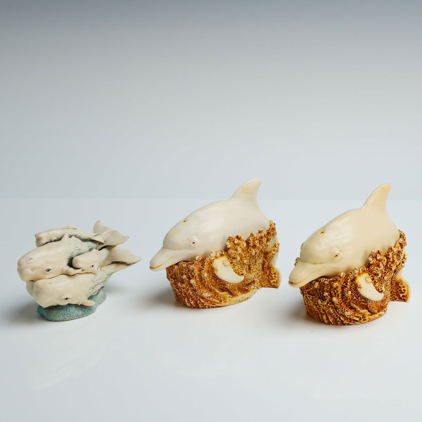 3pc Harmony Kingdom Trinket Boxes, On A Roll & Pod Parade: Three Harmony Kingdom Treasure Jest trinket box figurines, including two On A Roll dolphin (TJLDO) & one Pod Parade (TJWH5). Produced in England, these pieces are crafted from a crushed marble and res