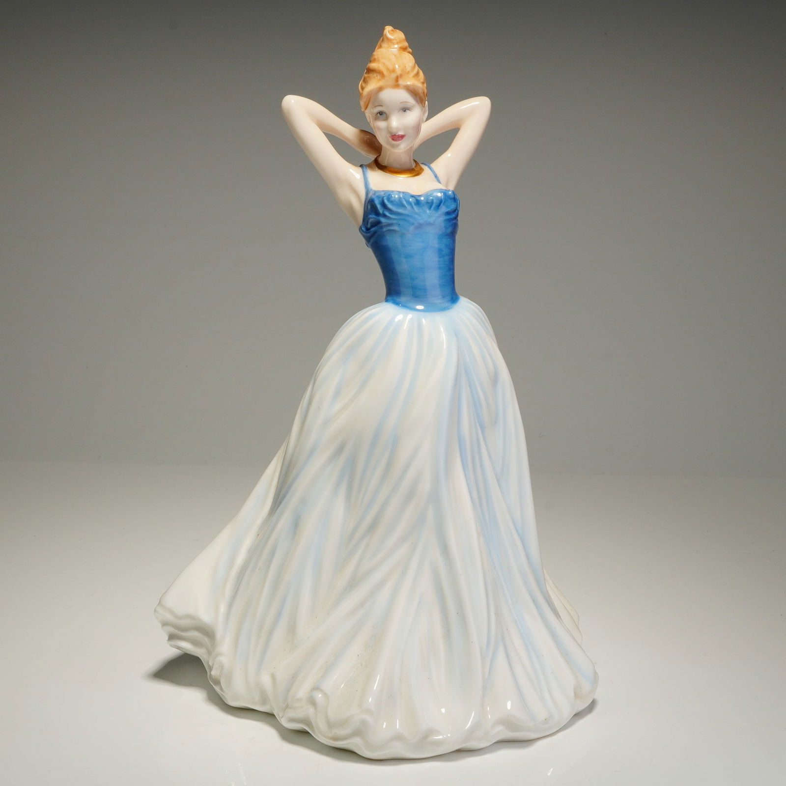 Royal Doulton Classics In Vogue Figurine, Finishing Touch HN4329: A Royal Doulton bone china figurine titled Finishing Touch, model number HN4329, from the Classics In Vogue collection. Modeled by Valerie Annand and dated 2001, this hand-decorated piece depicts a fe
