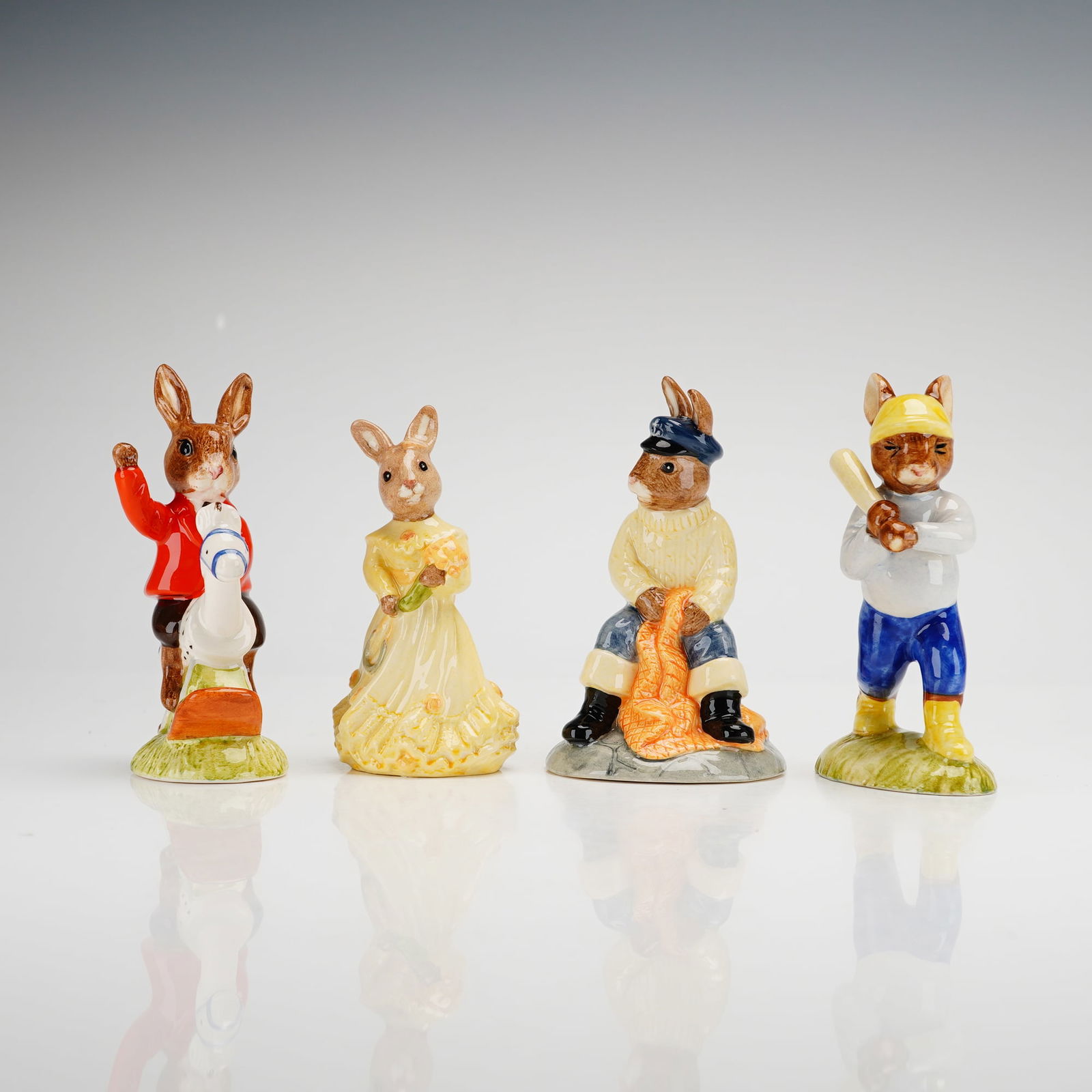 4pc Royal Doulton Bunnykins Figurines: This collection of 4pc Royal Doulton Bunnykins figurines features anthropomorphic rabbits in various themed costumes and poses. The group includes figures identified by DB numbers 170, 43, 69, and 175