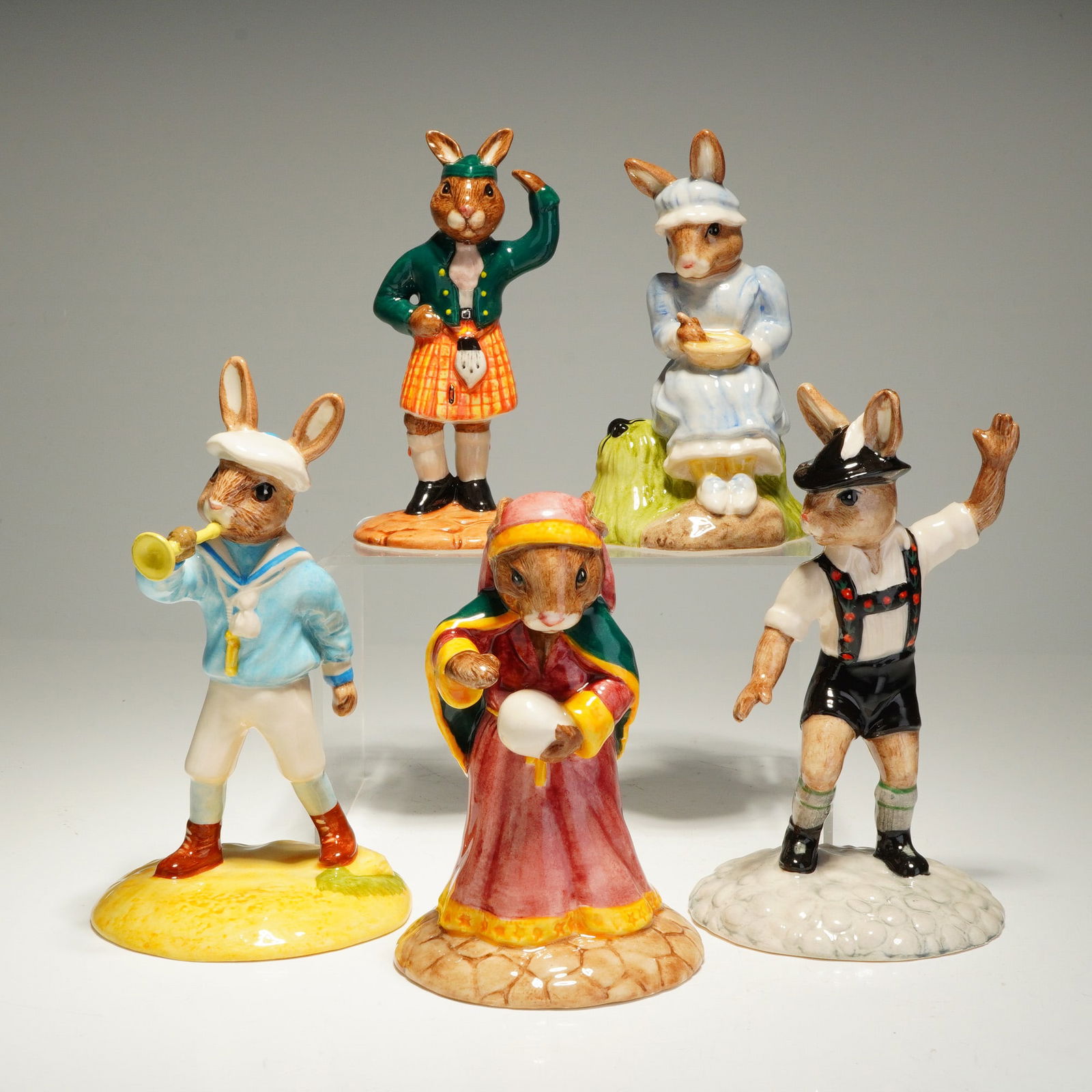 5pc Royal Doulton Bunnykins Little Miss Muffet Tyrolean Dancer Fortune: A collection of five Royal Doulton Bunnykins ceramic figurines, each hand-decorated with a high-gloss glaze. The group includes Little Miss Muffet DB240 from the Nursery Rhyme Collection 2001, Little