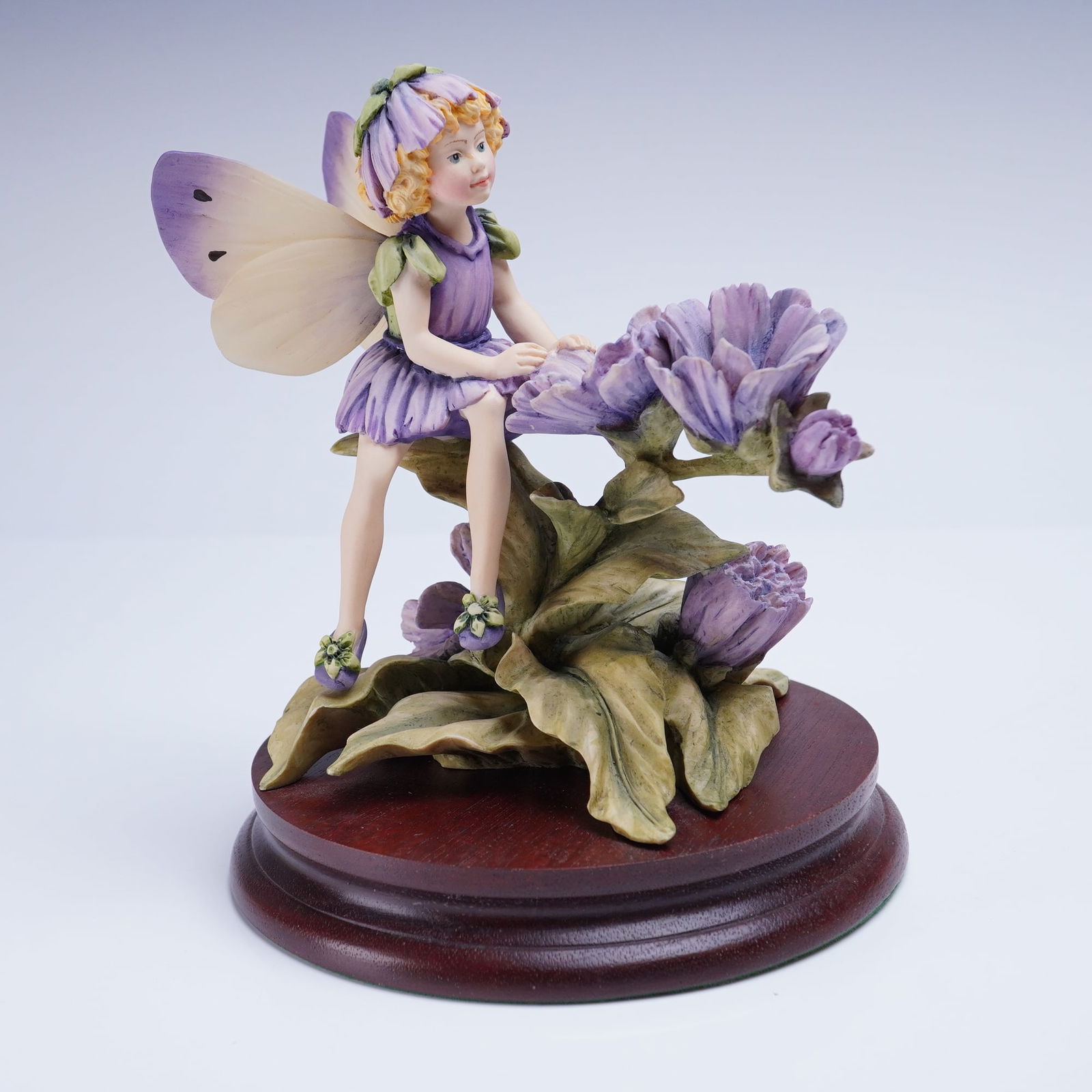 Border Fine Arts Cicely Mary Barker Flower Fairy Figurine: A collectible Border Fine Arts Cicely Mary Barker Flower Fairy Figurine. This handmade fairy figurine is executed in molded and hand-painted resin, depicting a young fairy predominantly dressed in