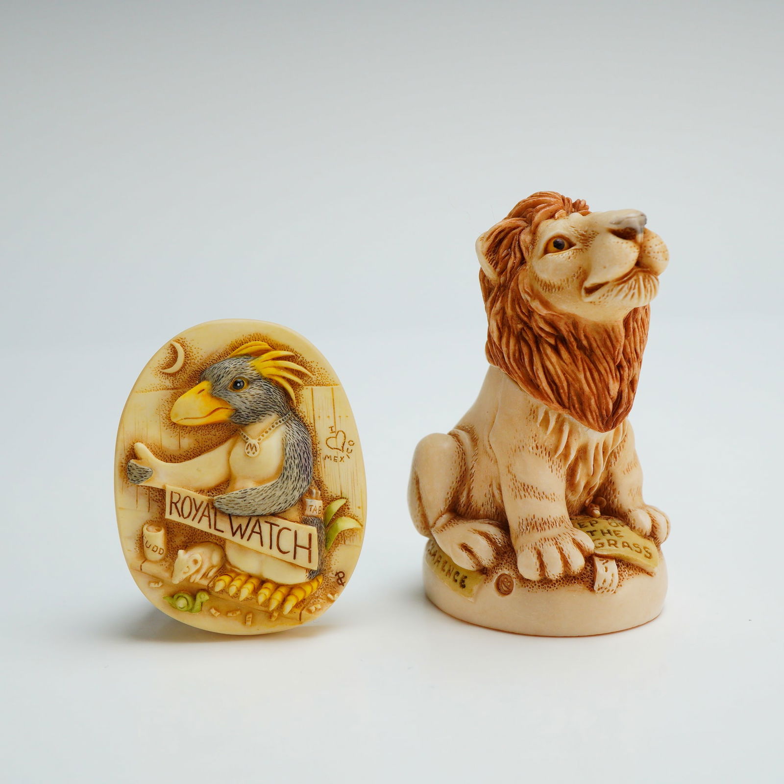 2pc Harmony Kingdom Rule Britannia Royal Watch Kit: Royal Watch Collector Club Kit, featuring one Rule Britannia trinket box and one pin. The trinket box, Rule Britiannia, depicts a seated lion with a removable head. The base of the figurine includes