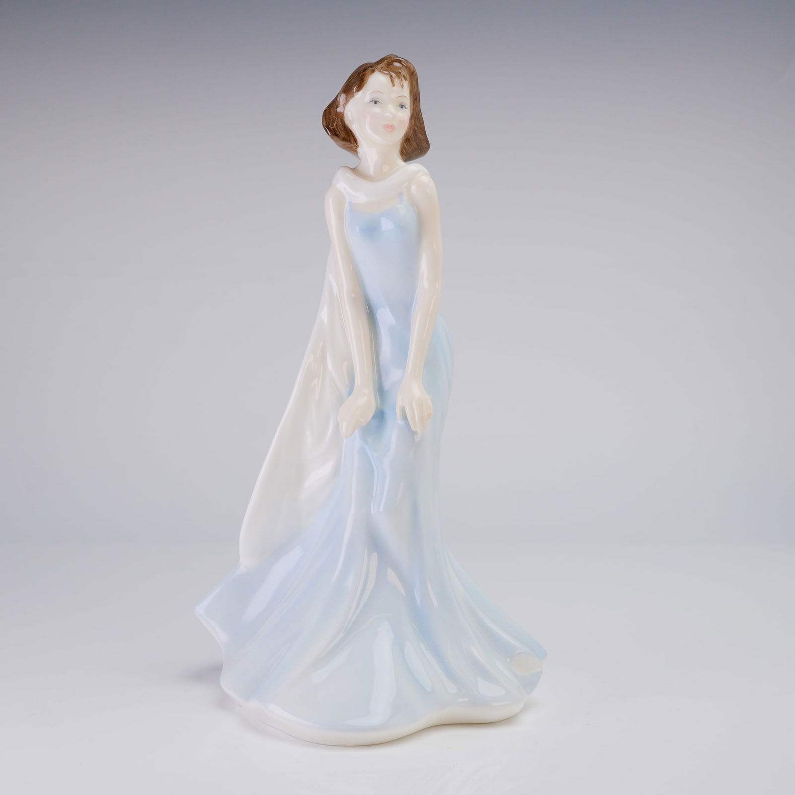 Royal Doulton Bone China Figurine, Allison HN4207: A Royal Doulton Bone China Figurine, Allison, depicting a woman in a flowing white and light blue gown, modeled by Jannick Vandevort and copyrighted 1999. Dimensions: 4.75"L x 4.25"W x 8.50"H