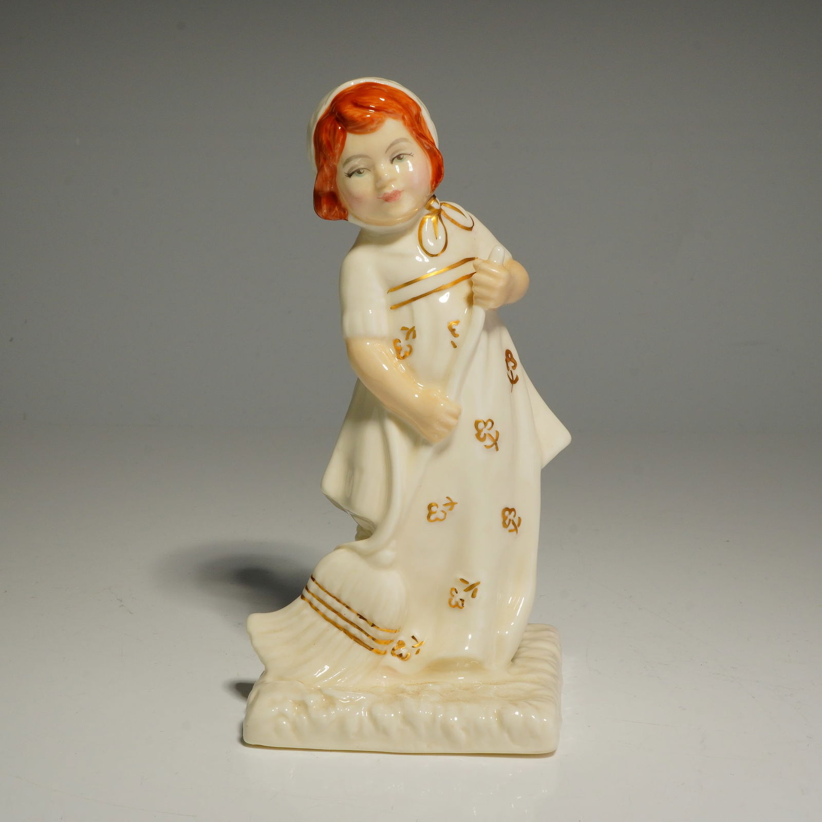 Royal Doulton Figurine, Helping Mother HN4228: A Royal Doulton bone china figurine titled Helping Mother, reference number HN 4228, from The Ivory and Gold Collection. This piece was modeled by Nada M. Pedley in 1999. The figurine depicts a young