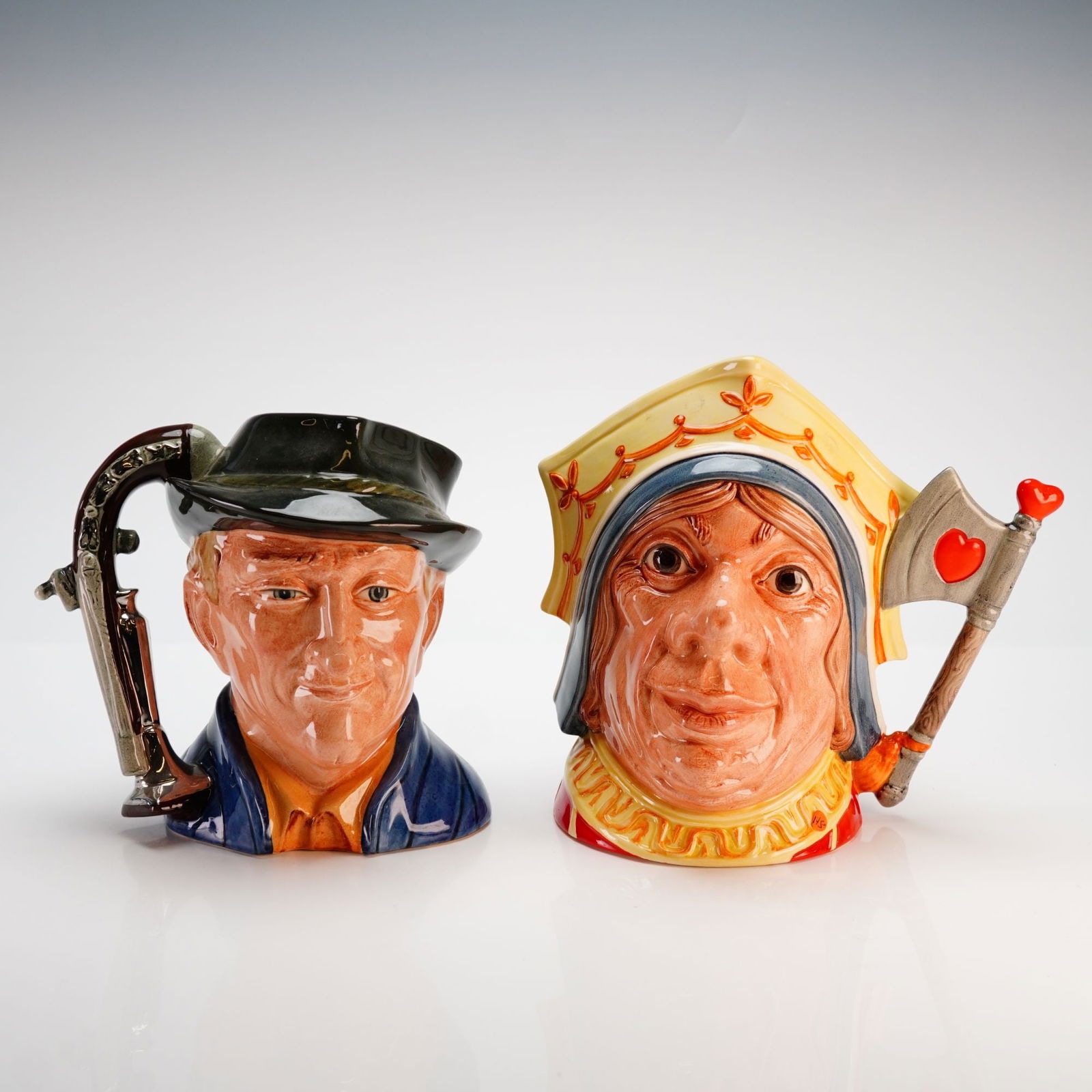 Royal Doulton The Red Queen and The Antique Dealer Character Jugs: This lot features a pair of large, professionally hand-painted glazed earthenware character jugs manufactured by Royal Doulton. The first jug, titled The Antique Dealer (D6807), was modeled by G. Blow
