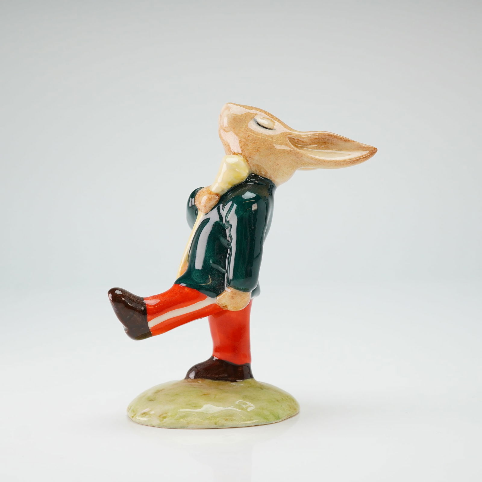 Royal Doulton Bunnykins Figurine, Drum-Major DB 109: A Royal Doulton Bunnykins glazed ceramic figurine titled Drum-Major Bunnykins, model DB 109, from The Oompah Band series. The anthropomorphic rabbit character is depicted in a marching pose with one l