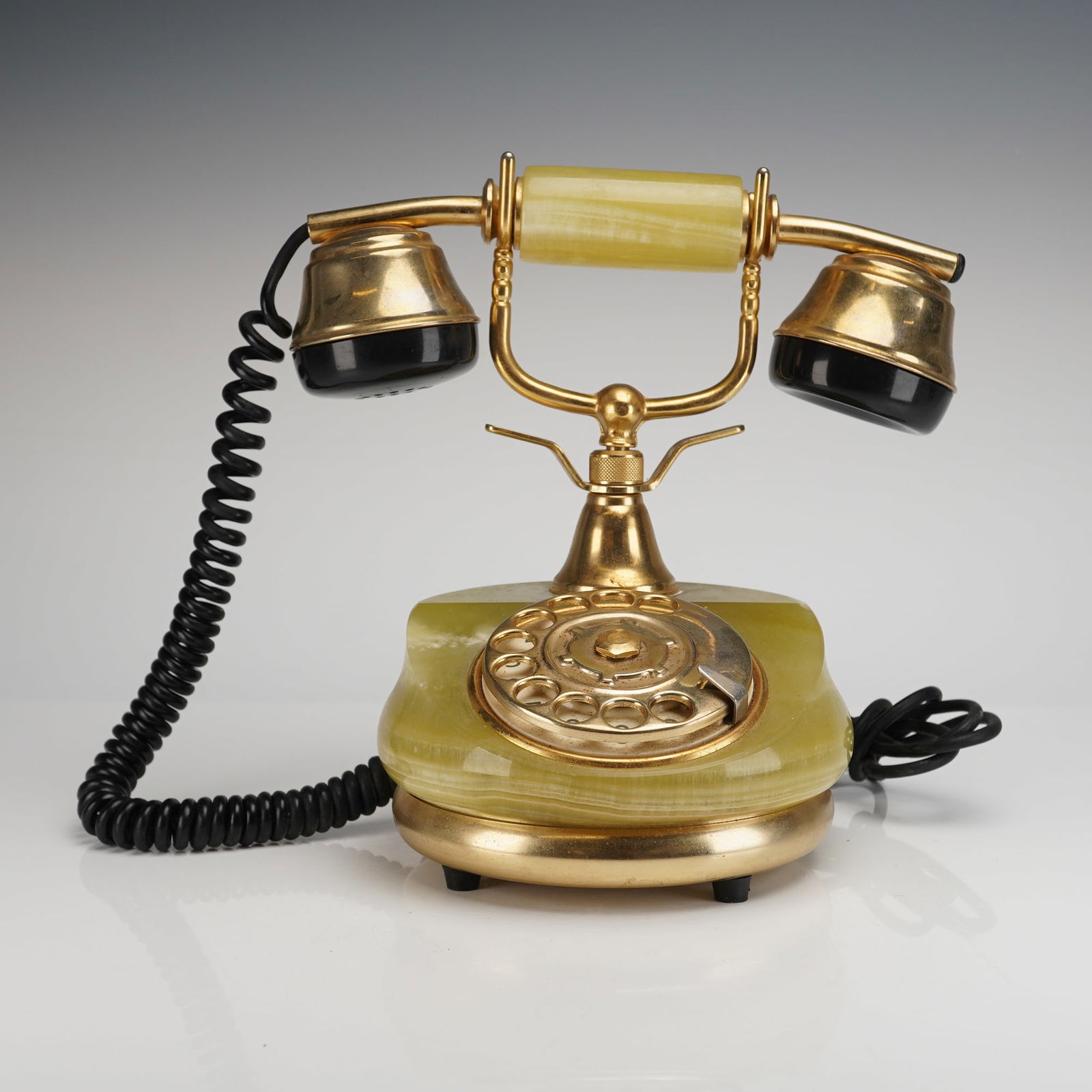 24K Gold Plated Ricci Paolo Onix Rotary Desk Telephone: The item features a substantial, bulbous gemstone base constructed of polished green and yellow banded onyx. The telephone is executed in a Neo-Classical or French revival style. All visible metal com