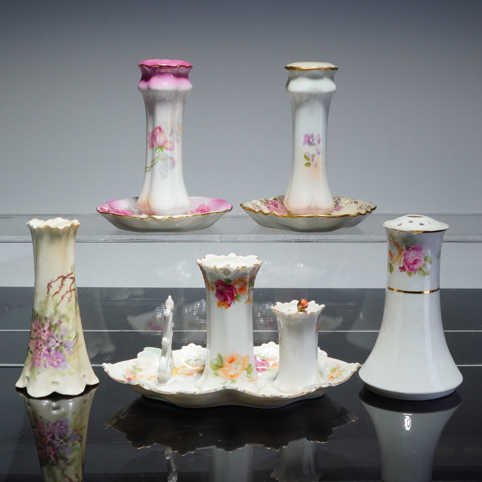 5pc Porcelain Hat Pin Holders Including Nippon, RS Prussia, and MZ Austria: A collection of five hand-painted porcelain hat pin holders featuring various European and Japanese backstamps. The group includes marked hand painted Nippon, MZ Austria Moritz Zdekauer, RS Reinhold S