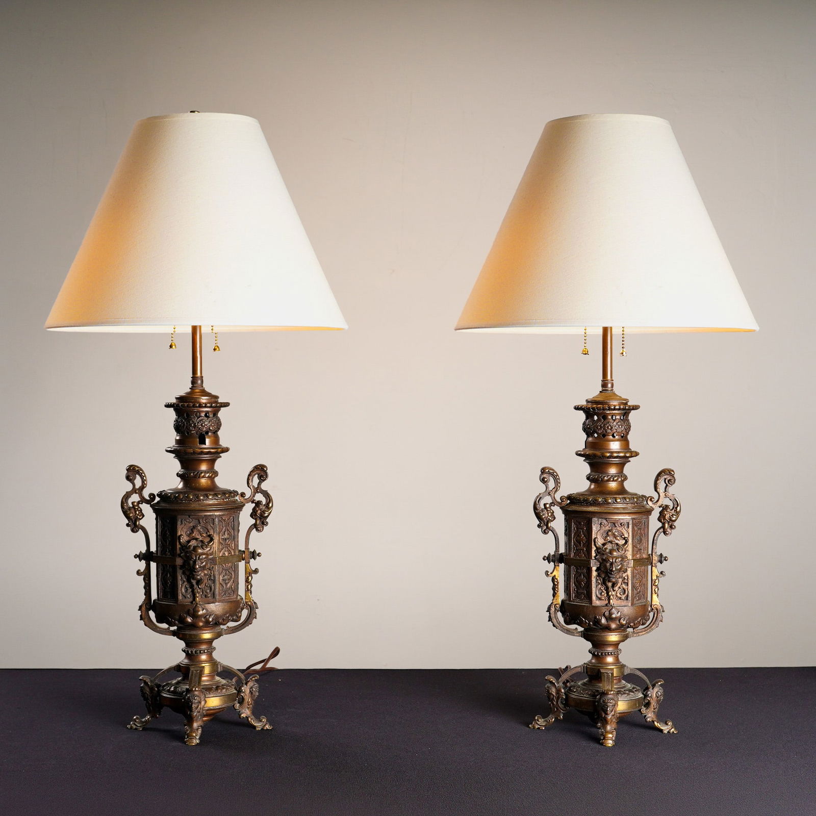 Pair of Bronze Lamps with High Relief Mascarons & Foliate Scrolls (1 of 5)
