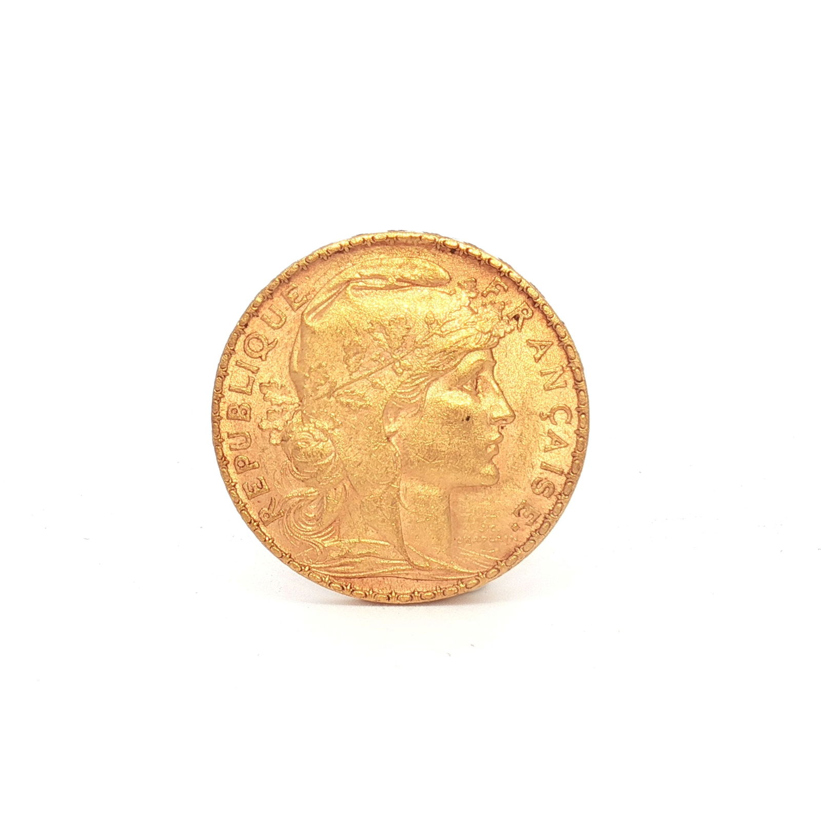 1903 French 20 Francs Rooster Gold Coin: Minted by the Monnaie de Paris. The obverse depicts the right-facing profile of Marianne wearing a Phrygian cap and an oak branch crown. The reverse displays the French motto "Liberte, Egalite, Frater