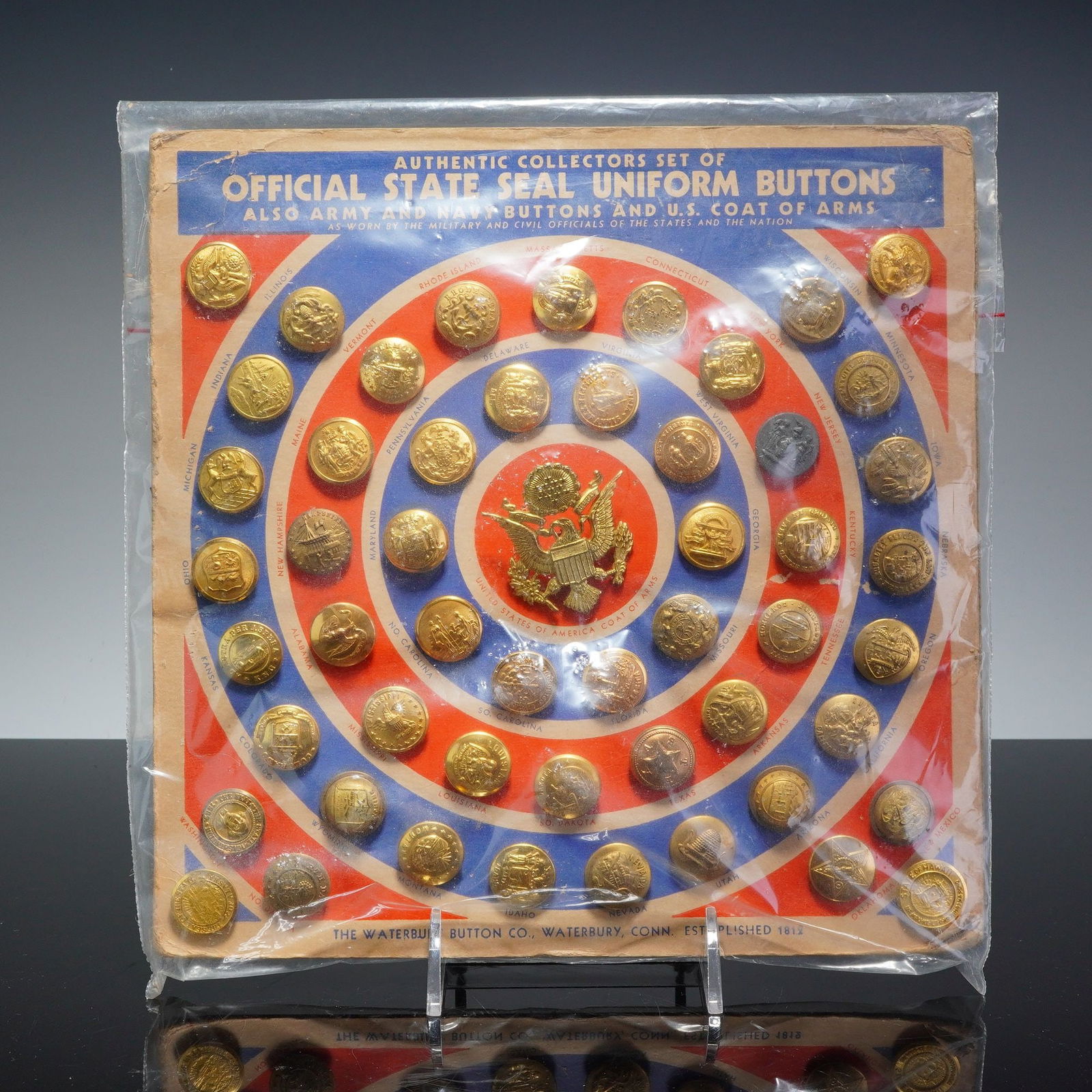 Waterbury Official United State Seal Uniform Buttons Collectors Set: This is an authentic mid-20th century collector's display set of Official State Seal Uniform Buttons manufactured by the historic Waterbury Button Company of Waterbury, Connecticut. Established in 181