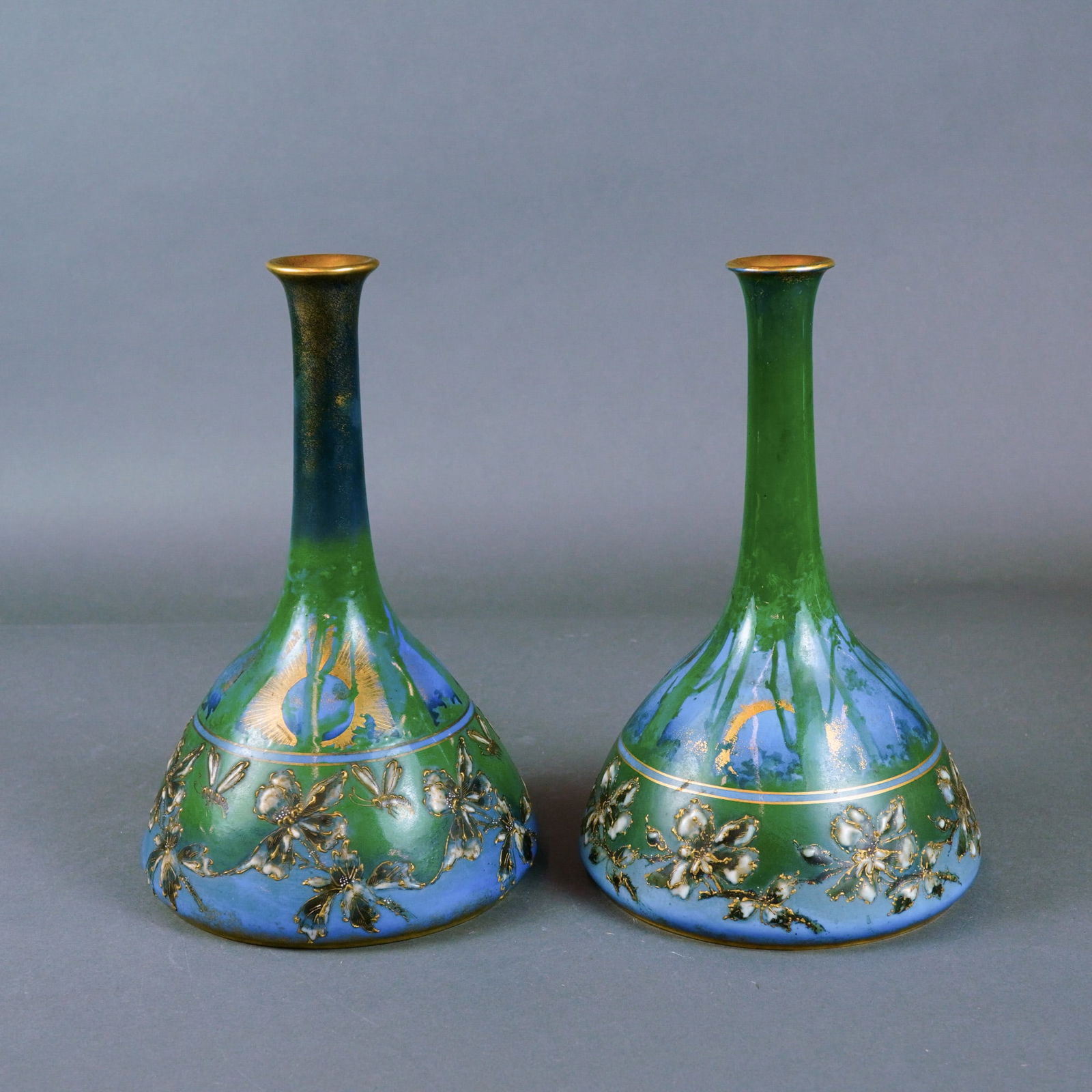 Pair of Riessner, Stellmacher & Kessel Vases: This exquisite Turn-Teplitz, Bohema pair of vases represents a premier example of Art Nouveau ceramic artistry from the late 19th to early 20th century. Produced by Riessner, Stellmacher & Kessel (RSt