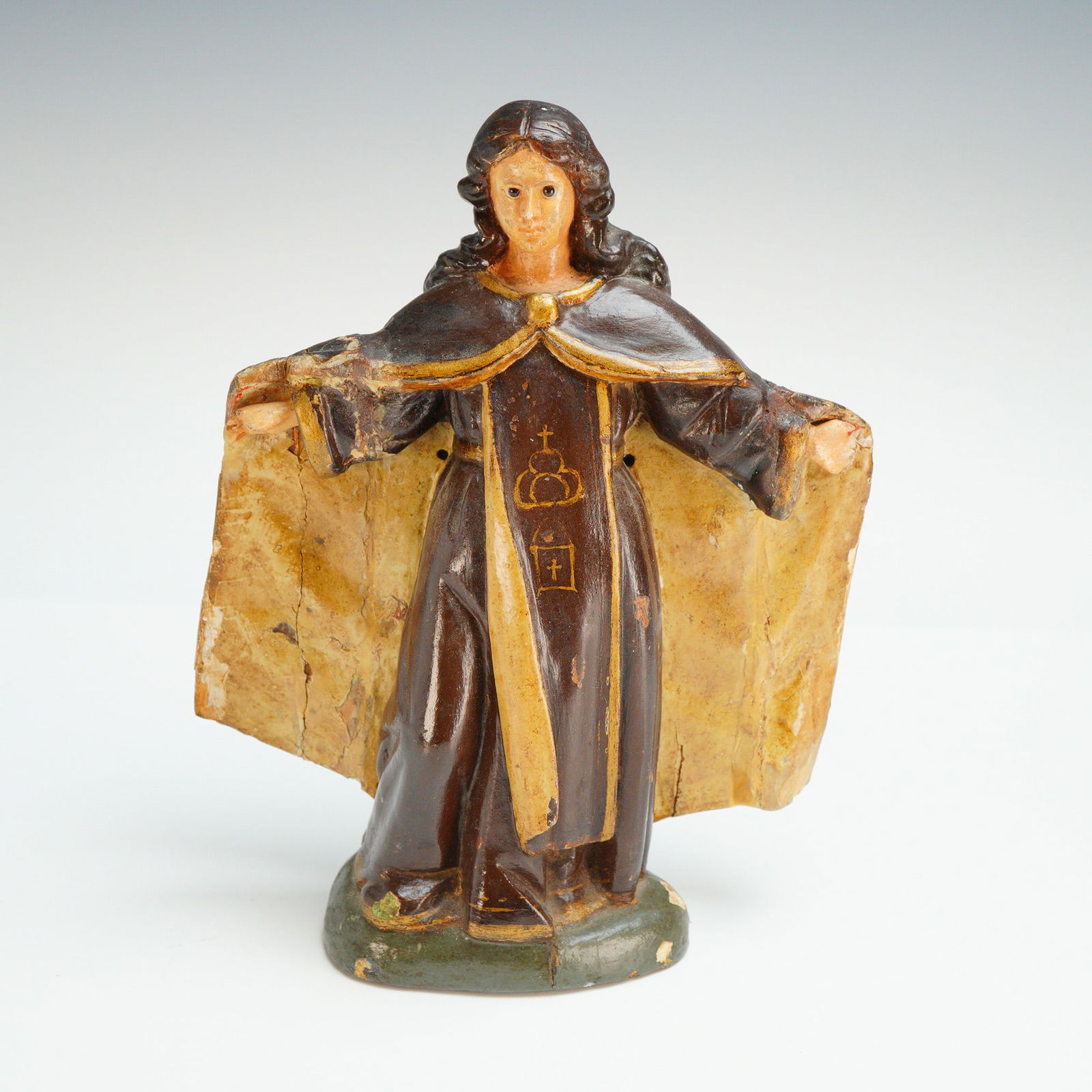 Antique Polychrome Carved Santos Figurine: An antique polychrome carved santos figurine depicting Our Lady of Mercy (Virgen de la Merced). This religious figure is constructed from carved wood with a gesso and polychrome finish. The figure is