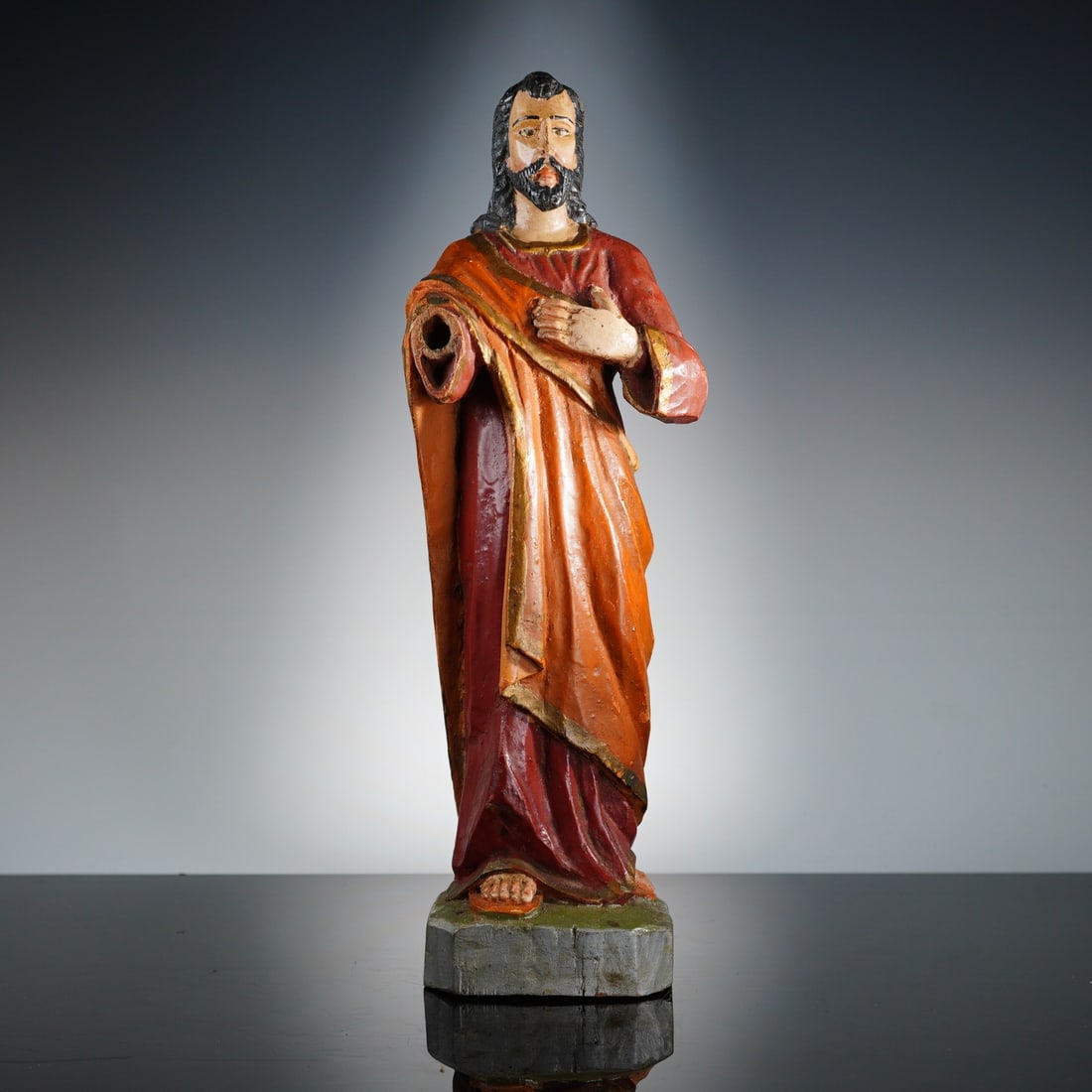 Polychrome Carved Wood Figure Sacred Heart: A late 19th to early 20th century polychrome carved wood devotional figure of Jesus Christ Sacred Heart, likely of Latin American origin. The standing figure is depicted with long dark hair and a bear