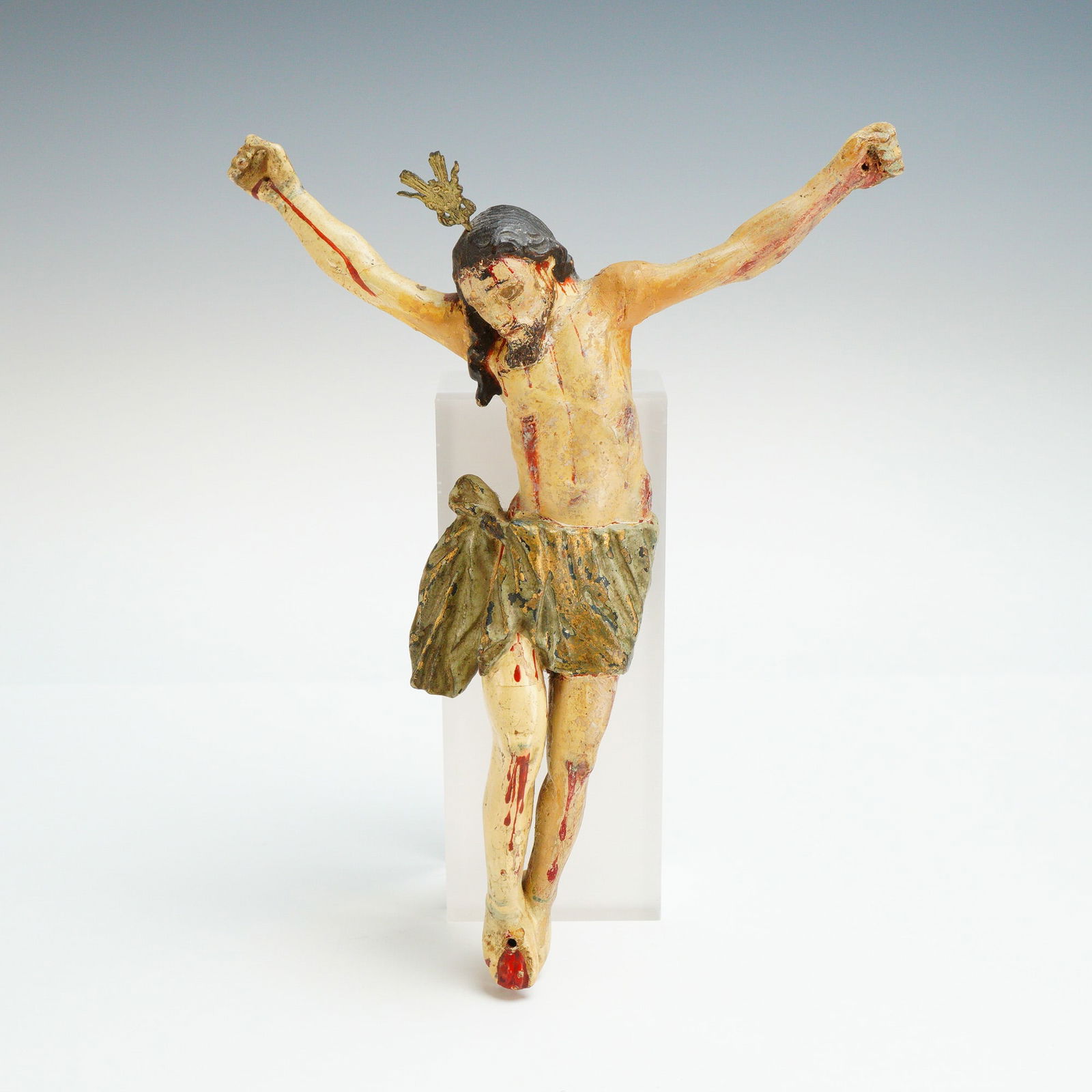 Spanish Colonial Carved Wood Corpus Christi Crucifixion: This Spanish Colonial Corpus Christi is a polychrome carved wood figure dating to the 18th or 19th century. The sculpture is depicted with a bowed head and features a green perizoma with traces of met