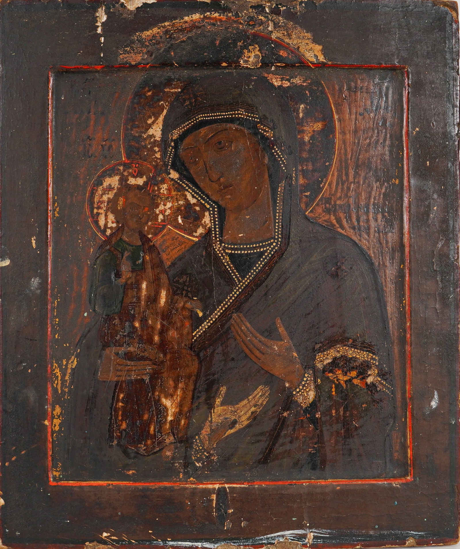 Russian Orthodox Icon, Tempera and Gilt on Wood, Our Lady of Vladimir: A Russian Orthodox icon of Our Lady of Vladimir (Virgin and Child) painted on a wooden panel in tempera and gilt, with the panel carved to become a frame for the painting. The composition depicts the