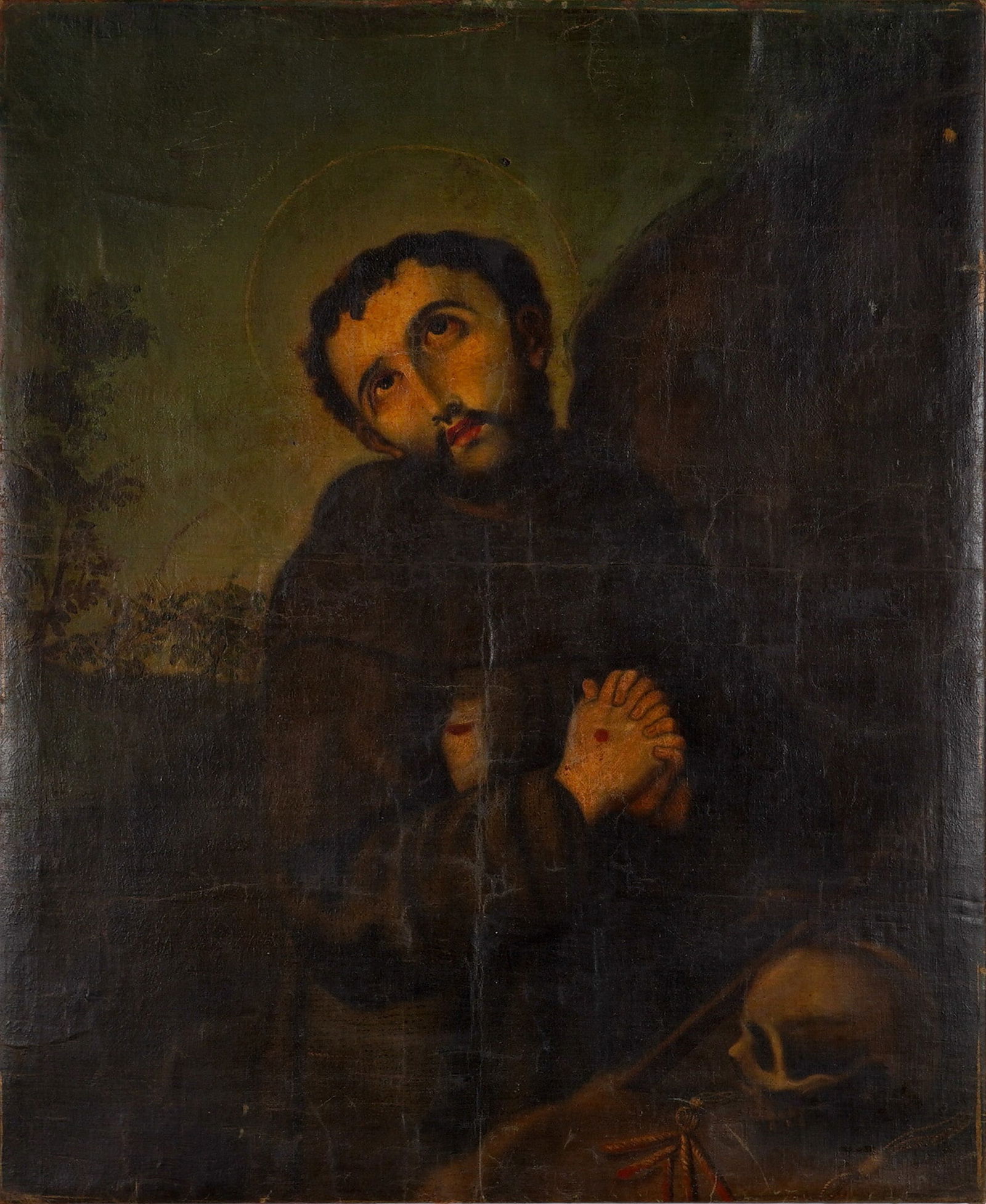 Original Oil on Canvas Painting of Saint Francis in Prayer: This original oil on canvas painting with dramatic chiaroscuro depicts Saint Francis in Prayer in a late Baroque period style. The saint is portrayed in a brown habit with hands clasped, revealing the