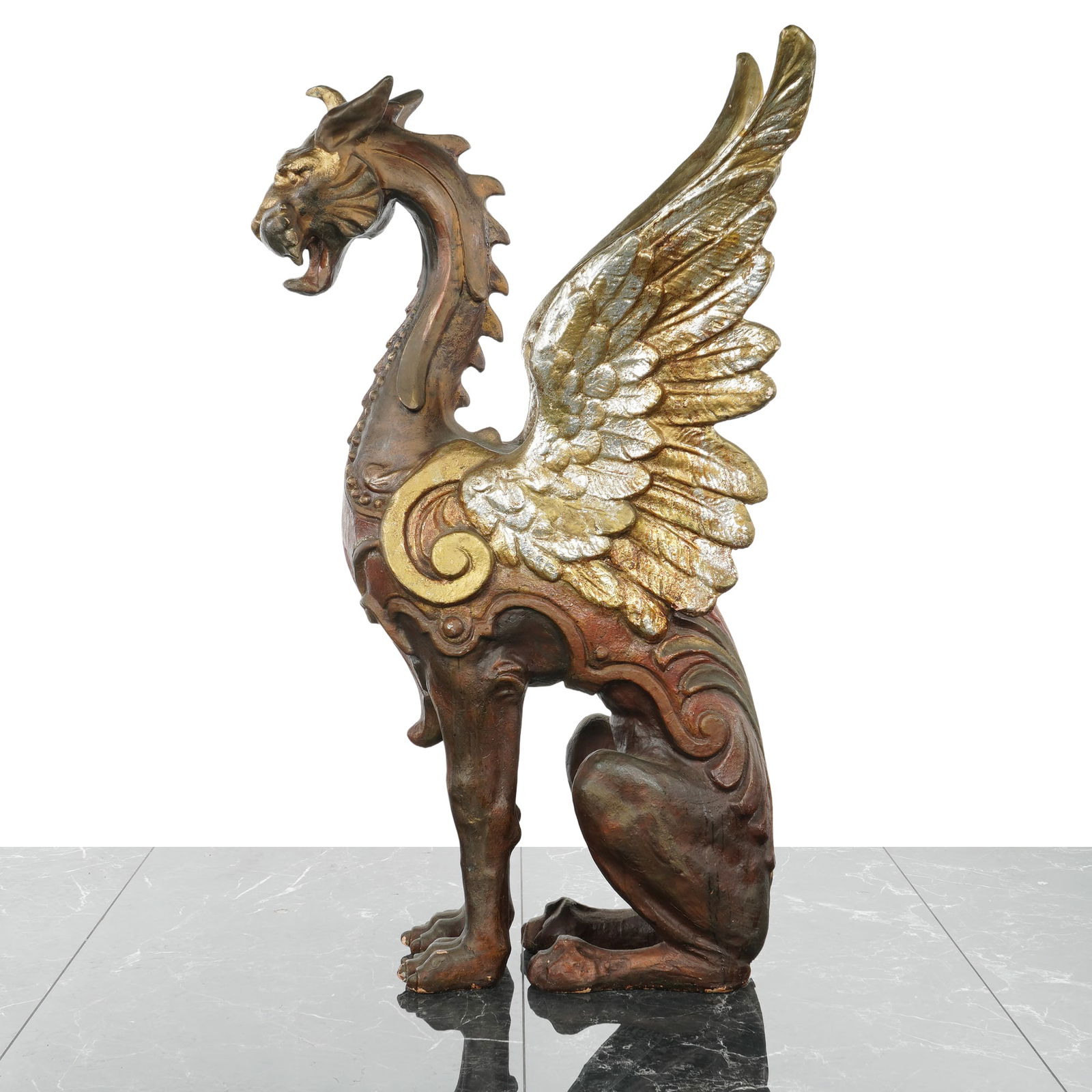 Parcel Gilt Wooden Winged Mythical Creature Sculpture: A large mythical creature sculpture with red and gilt paint. The creature is depicted in a seated upright posture with a slender, feline-like body and a long, arched neck, the back of which is