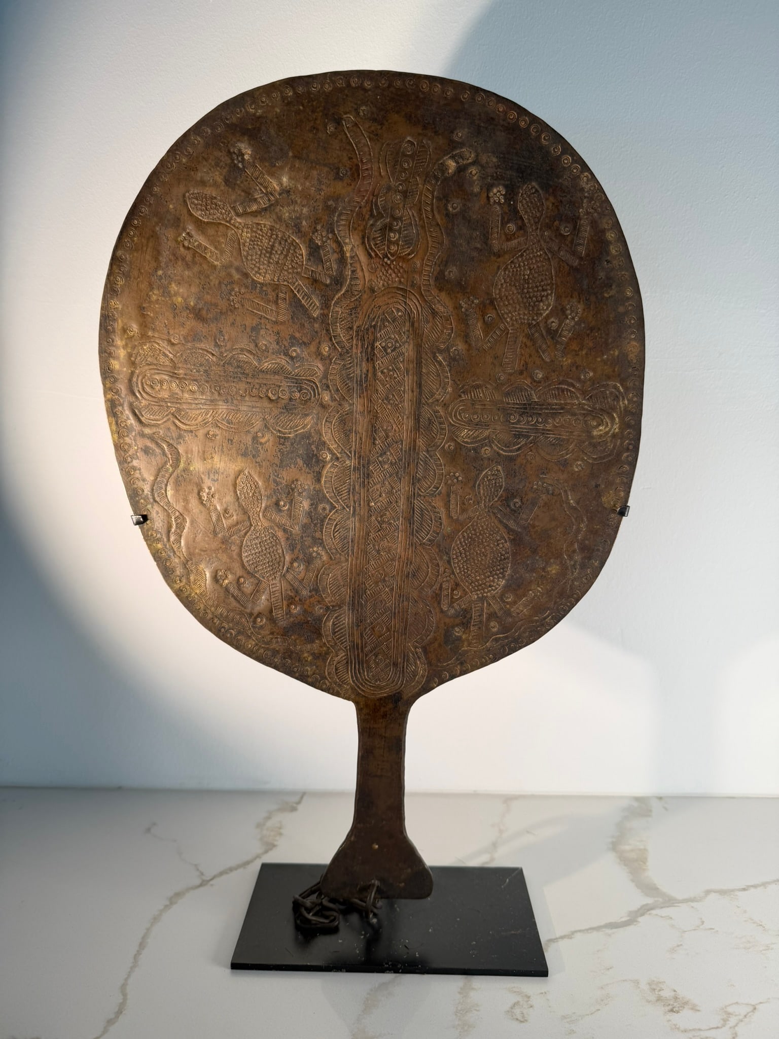 Yoruba Brass Abebe Fan for Oshun, Nigeria, 19th/20th Century: A Yoruba brass fan for the goddess Oshun (Osun), known as an abebe, originating from Nigeria. This sacred ceremonial object is paddle-shaped and was traditionally used by priestesses to honor Oshun, t