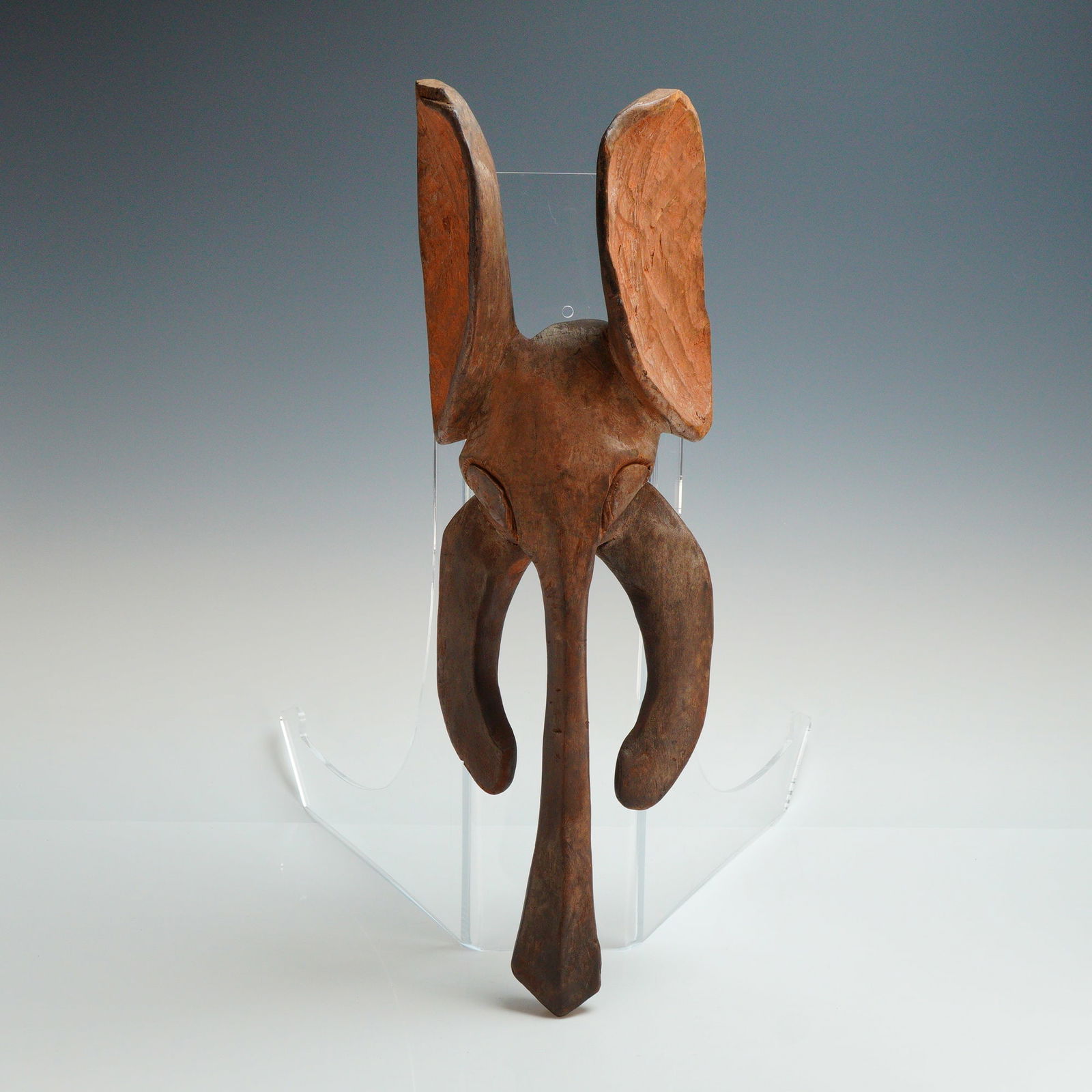 Babanki Wooden Elephant Wall Mask from the Cameroon Grassfields: A Babanki elephant wall mask from the Cameroon Grassfields, carved out of wood. This zoomorphic piece features large, upright ears with textured interior surfaces showing visible tool marks, a long ta