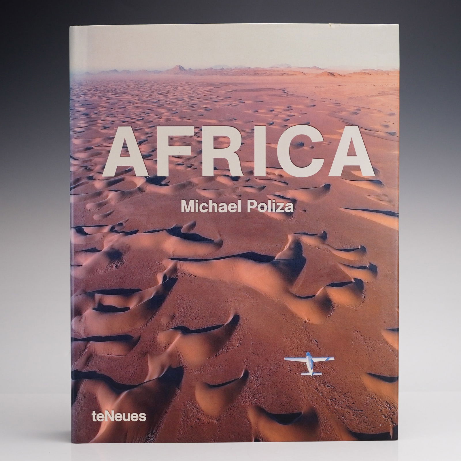 Poliza, Michael. Africa. teNeues, 2006. First Edition (DJ): Author: Michael Poliza. Full title: Africa. Kempen: teNeues, 2006. First edition. Binding: Publisher's oversize hardcover with pictorial boards and a matching pictorial dust jacket. Folio size. Number