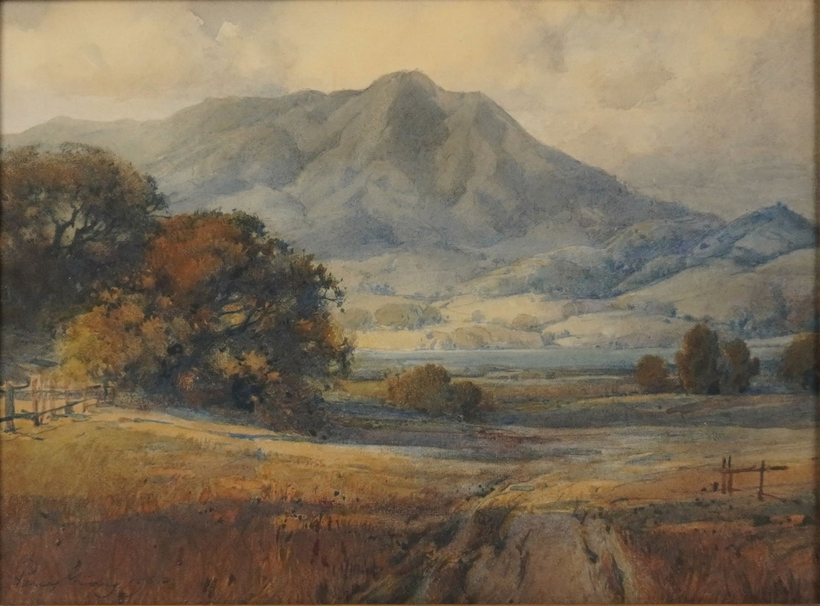 Percy Gray (American, 1869"1952) Signed Watercolor, Mt. Tamalpais, Signed: A watercolor painting by painter Percy Gray depicting Mount Tamalpais. The landscape features a large central mountain range under a pale sky, with rolling hills, a body of water, and fields dotted wi