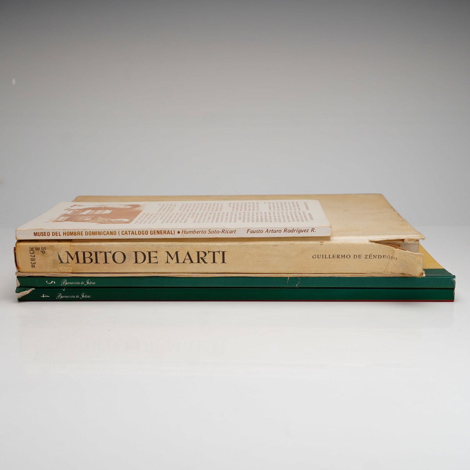 5 Caribbean and Cuban History & Culture Books and Ephemera: A collection of softcover books and printed ephemera primarily focused on Caribbean history, art, and culture, with a specific emphasis on Cuban and Dominican subjects. The group includes Ambito de Ma