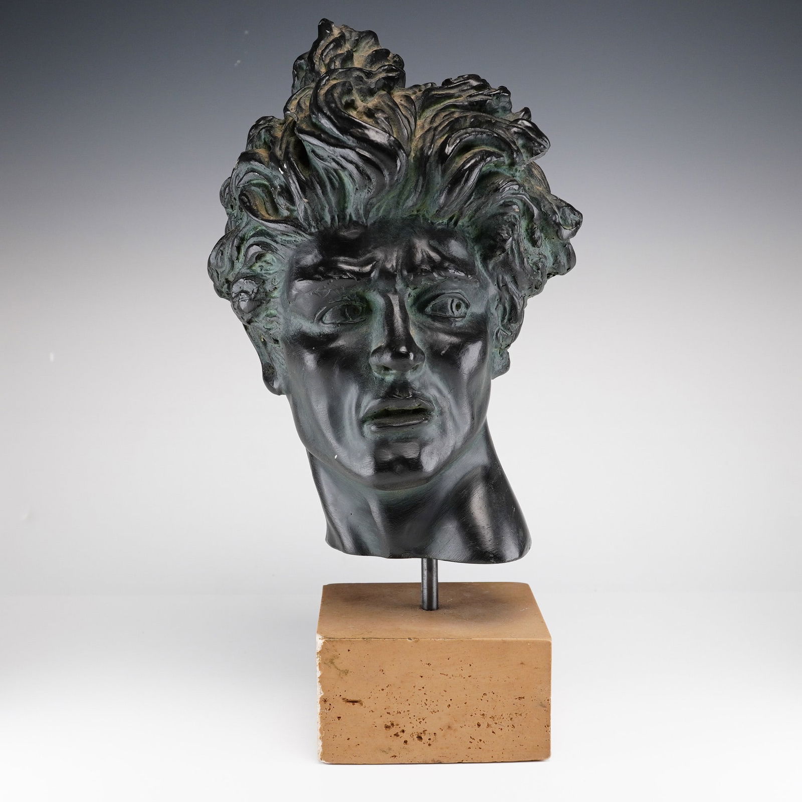 Edward Melcarth (American, 1914-1973) Heroic Head Resin Sculpture: This mid-20th-century cast resin bust, titled Heroic Head, is by the American artist Edward Melcarth. The sculpture depicts a male figure with a dramatic, anguished expression and highly stylized, flo