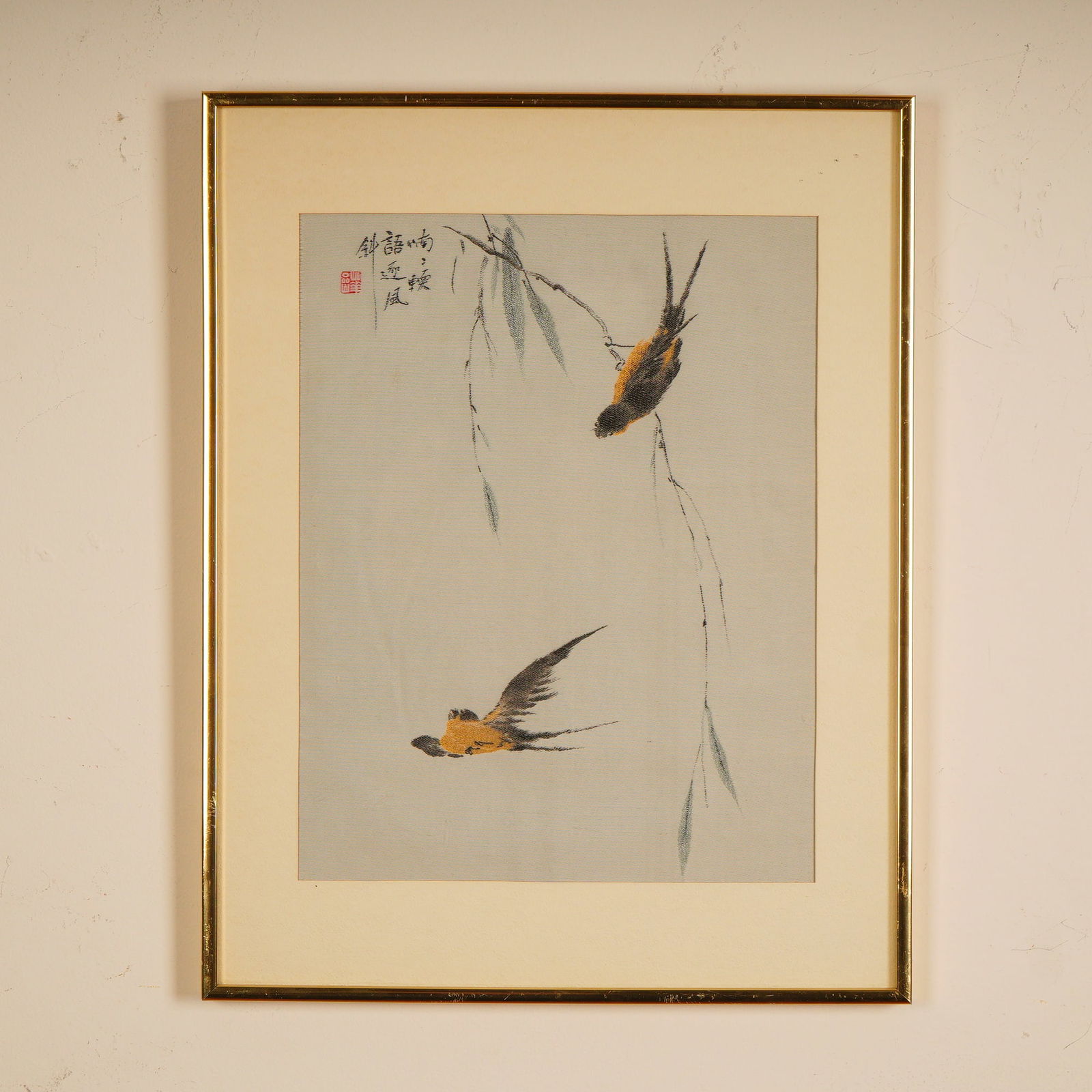 Chinese Textile Art after Qing Dynasty Painter Hua Yan, Swallows in Flight: A refined Asian textile artwork depicting two swallows in flight and repose among slender willow branches. The golden and black plumage of the birds is rendered with graceful economy, creating a
