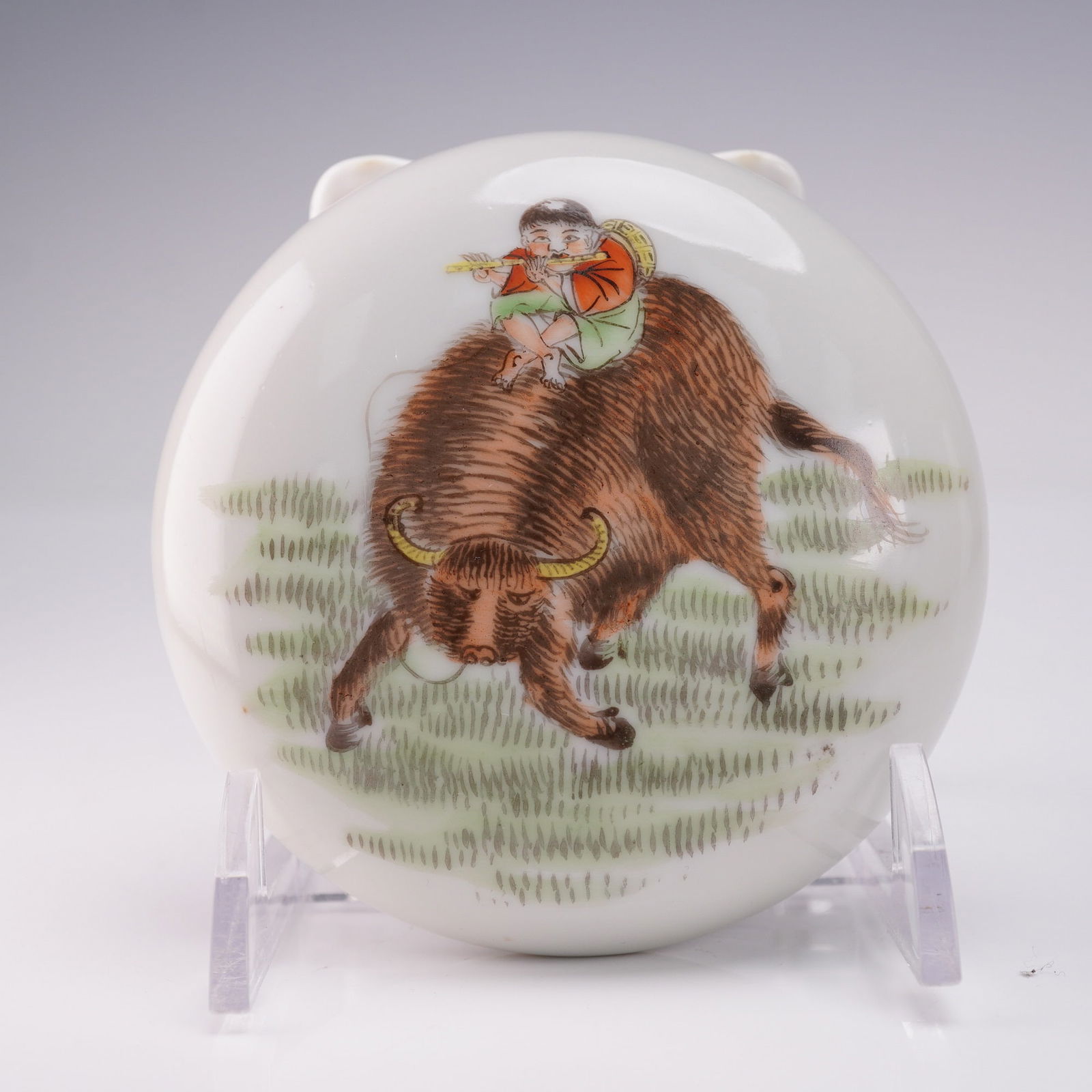 2pc Chinese Famille Rose Porcelain Seal Paste Box with Lid: A porcelain seal paste box with lid. The lid is decorated with an image of a boy playing a flute while seated on a water buffalo, set against a grassy background. The underside features red bat motifs