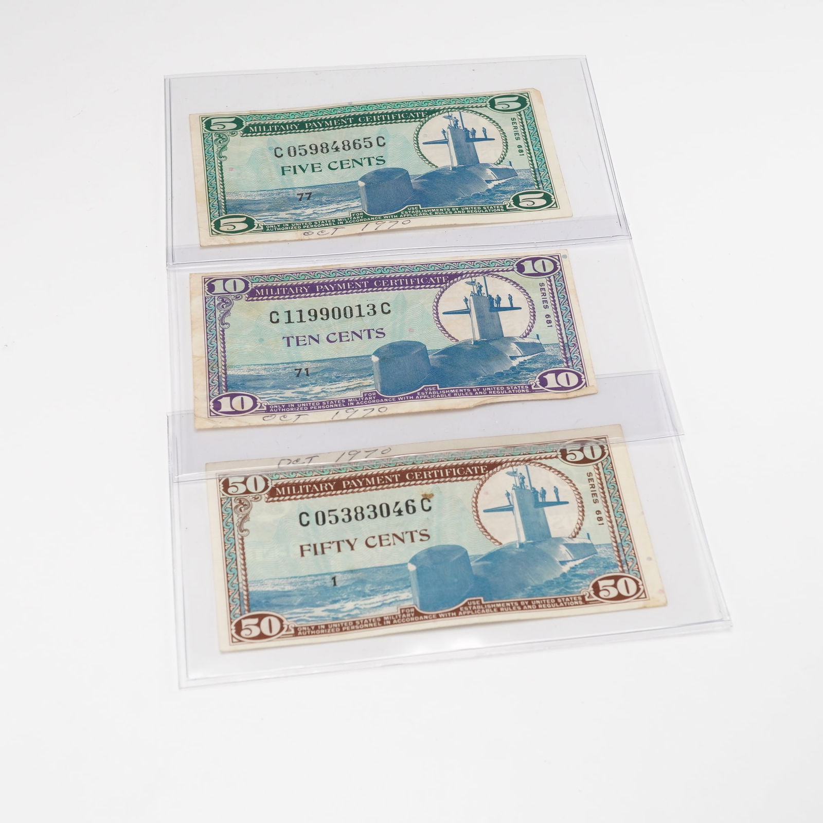 3pc Military Payment Certificates, Series 681 - 5, 10 & 50 Cents: U.S. Military Payment Certificates, Series 681, issued for use by American armed forces personnel between 1969 and 1970. Denominations include 5 cents (green), 10 cents (purple), and 50 cents