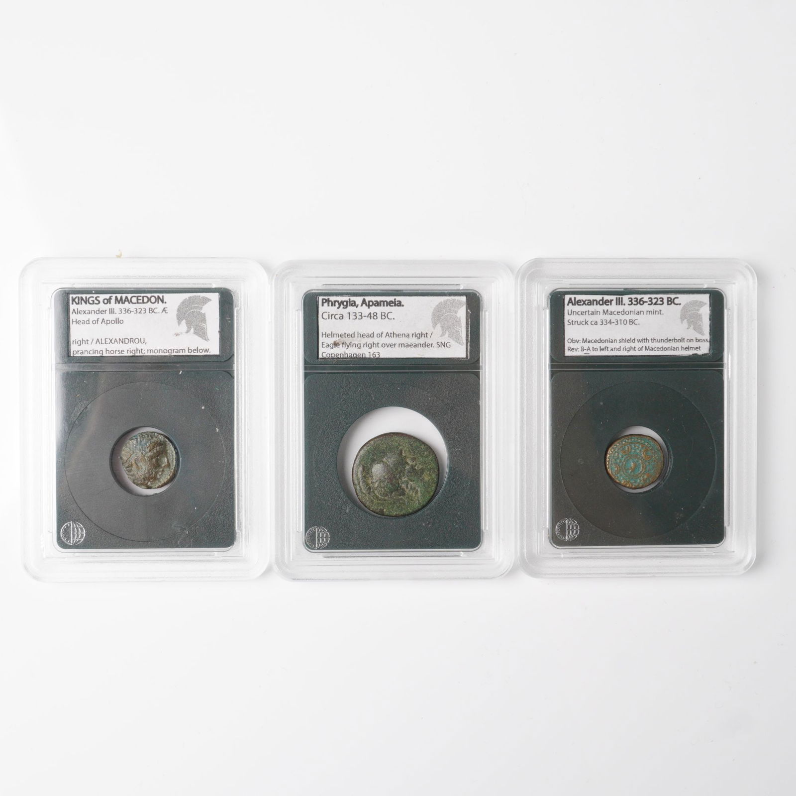 3pc Alexander the Great and Apameia Ancient Coins: Ancient coin collection, each graded and encapsulated by Main Street Rare Coins. The group features a Kings of Macedon Alexander III, 336-323 BC bronze with the head of Apollo and prancing horse