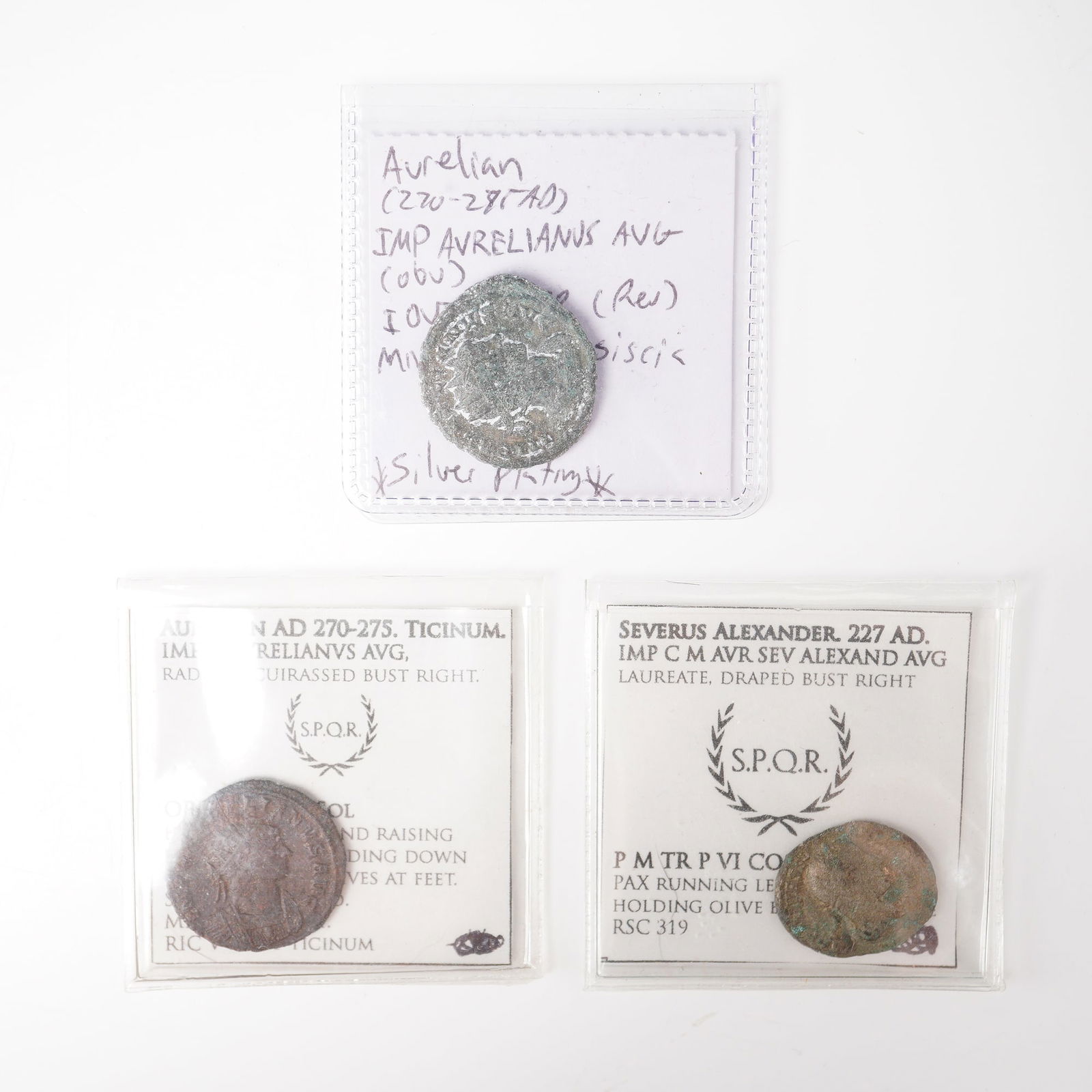 3pc Ancient Roman Bronze Aurelian & Severus Alexander Coins: The first, issued under Emperor Aurelian (AD 270-275), bears the inscription IMP AVRELIANVS AVG on the obverse with a radiate, cuirassed bust right; the reverse features ORIENS AVG depicting Sol