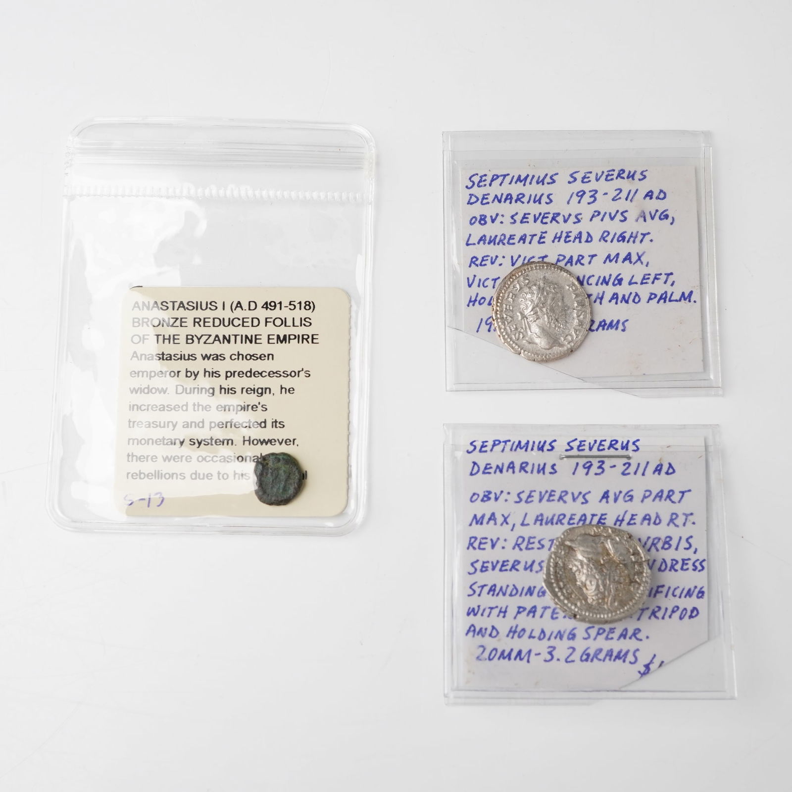 3pc Roman Severus Denarius & Byzantine Anastasius Reduced Follis Coins: Two silver denarii of Septimius Severus, each showing a laureate bust on the obverse with inscriptions SEVERVS PIVS AVG or SEVERVS AVG PART MAX, and reverses depicting either Victory advancing left
